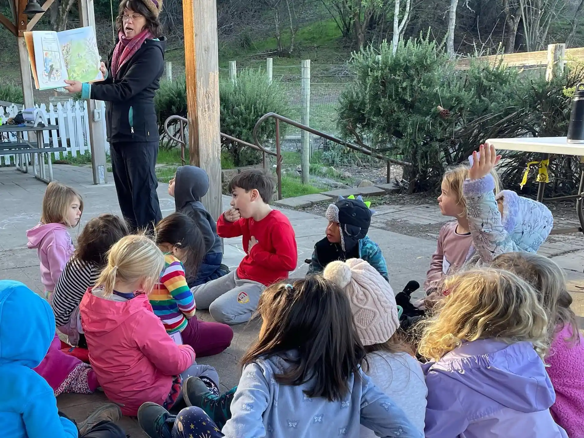 a group of children sitting on the ground
