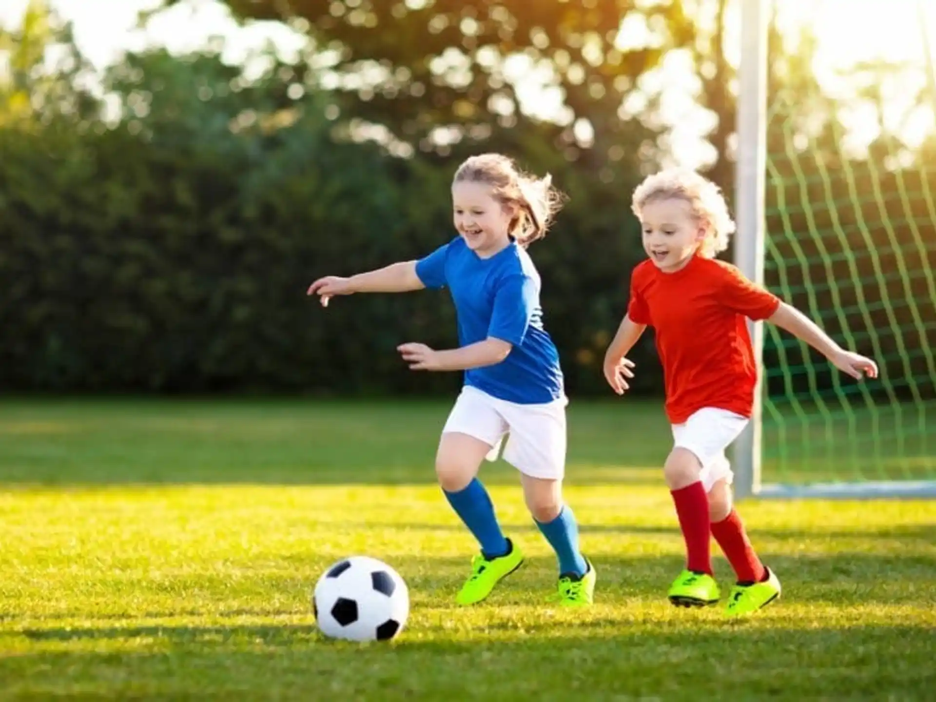 a couple of young girls playing football
