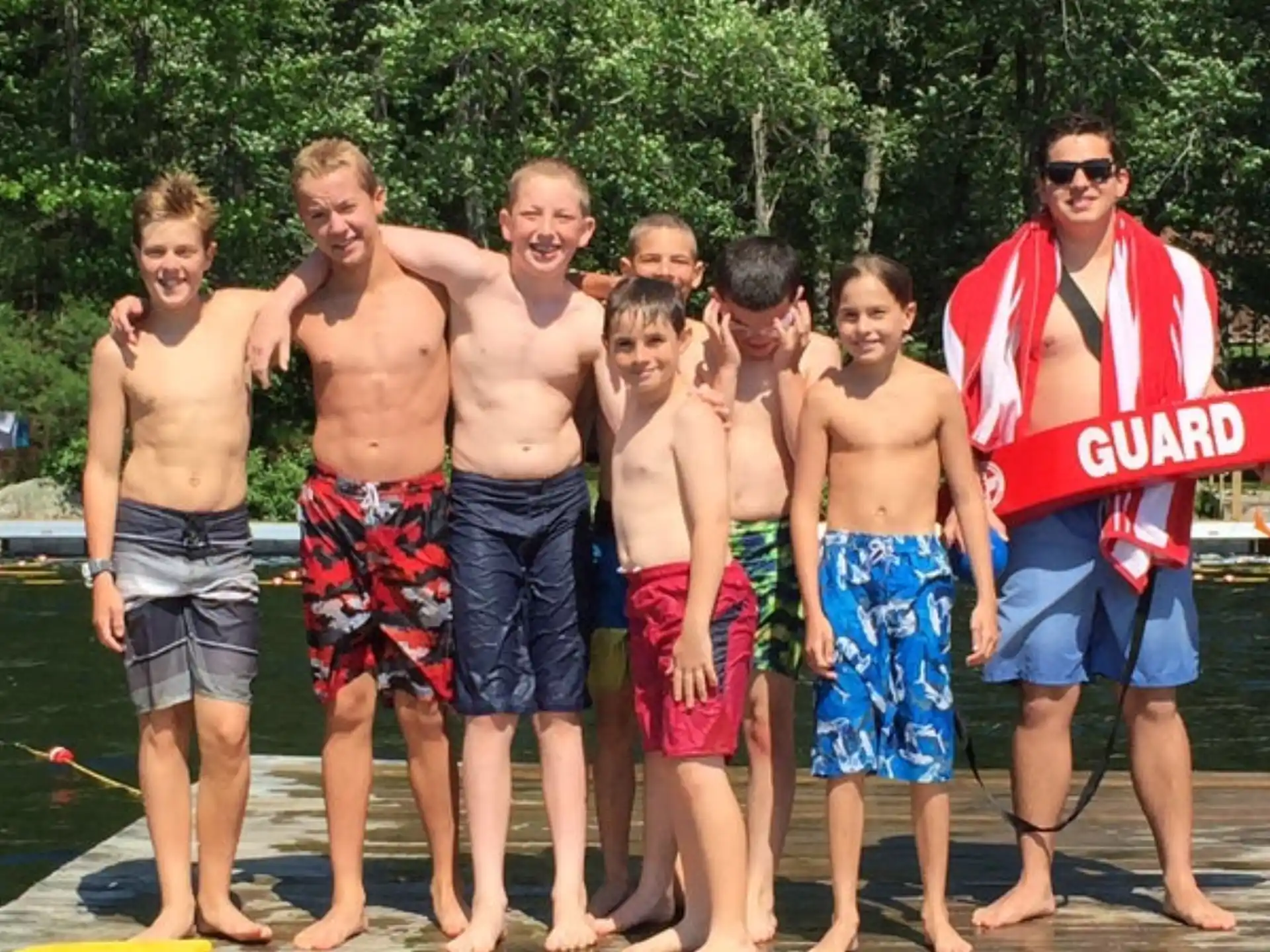 a group of men standing on a dock