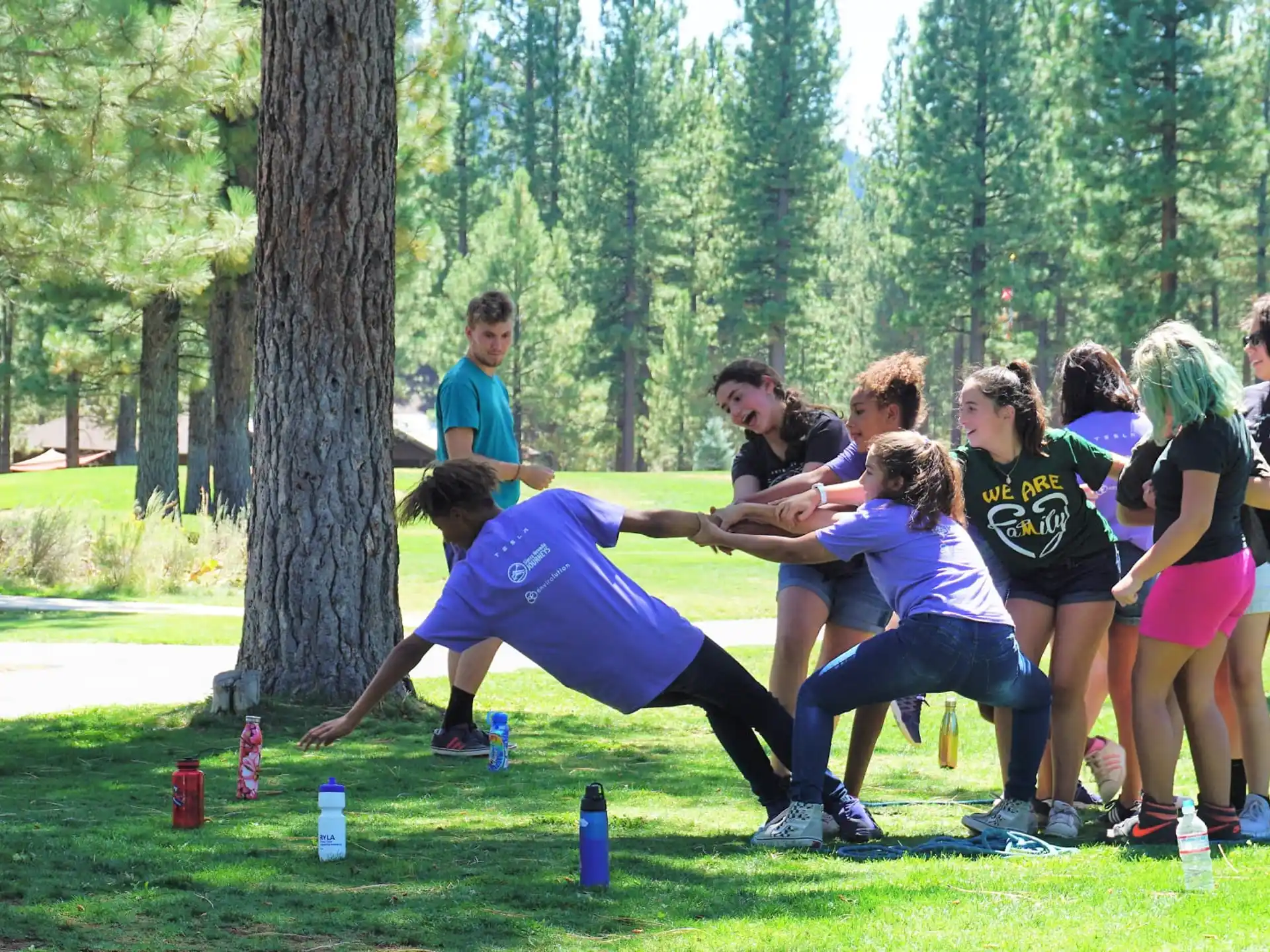 a group of people playing in a park