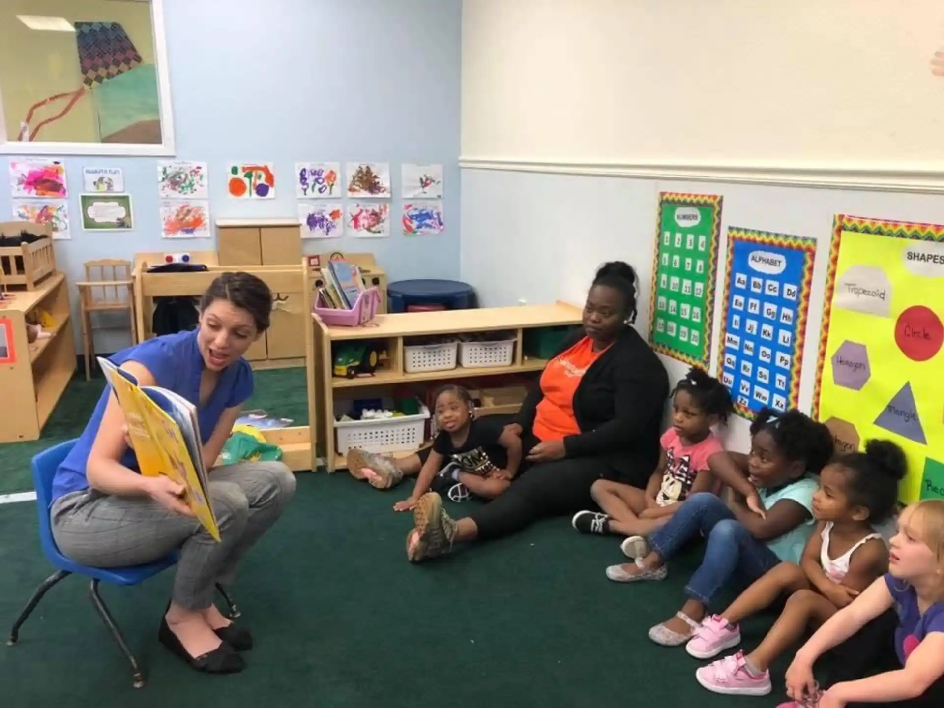 a group of people sitting in a classroom