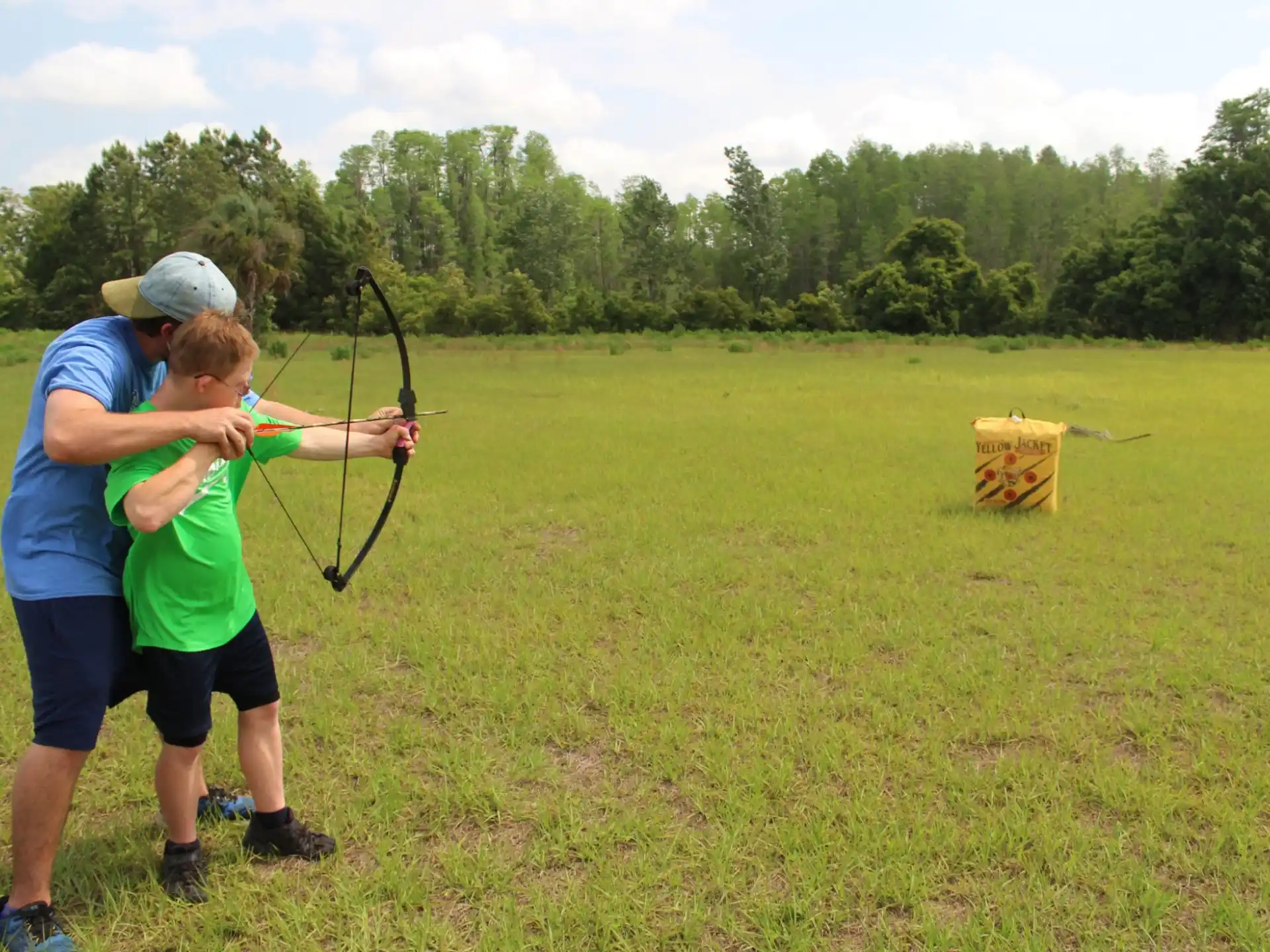 a couple of people shooting bows