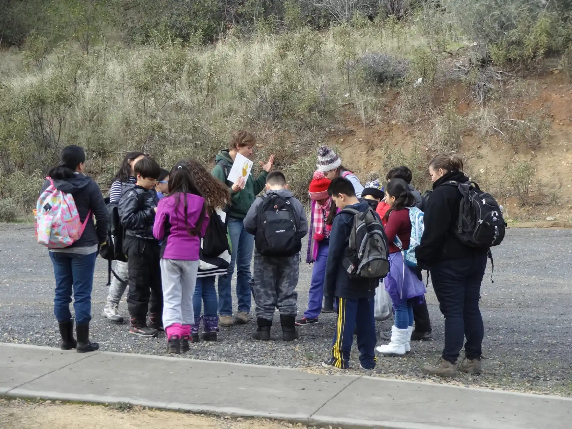 a group of people standing on a road