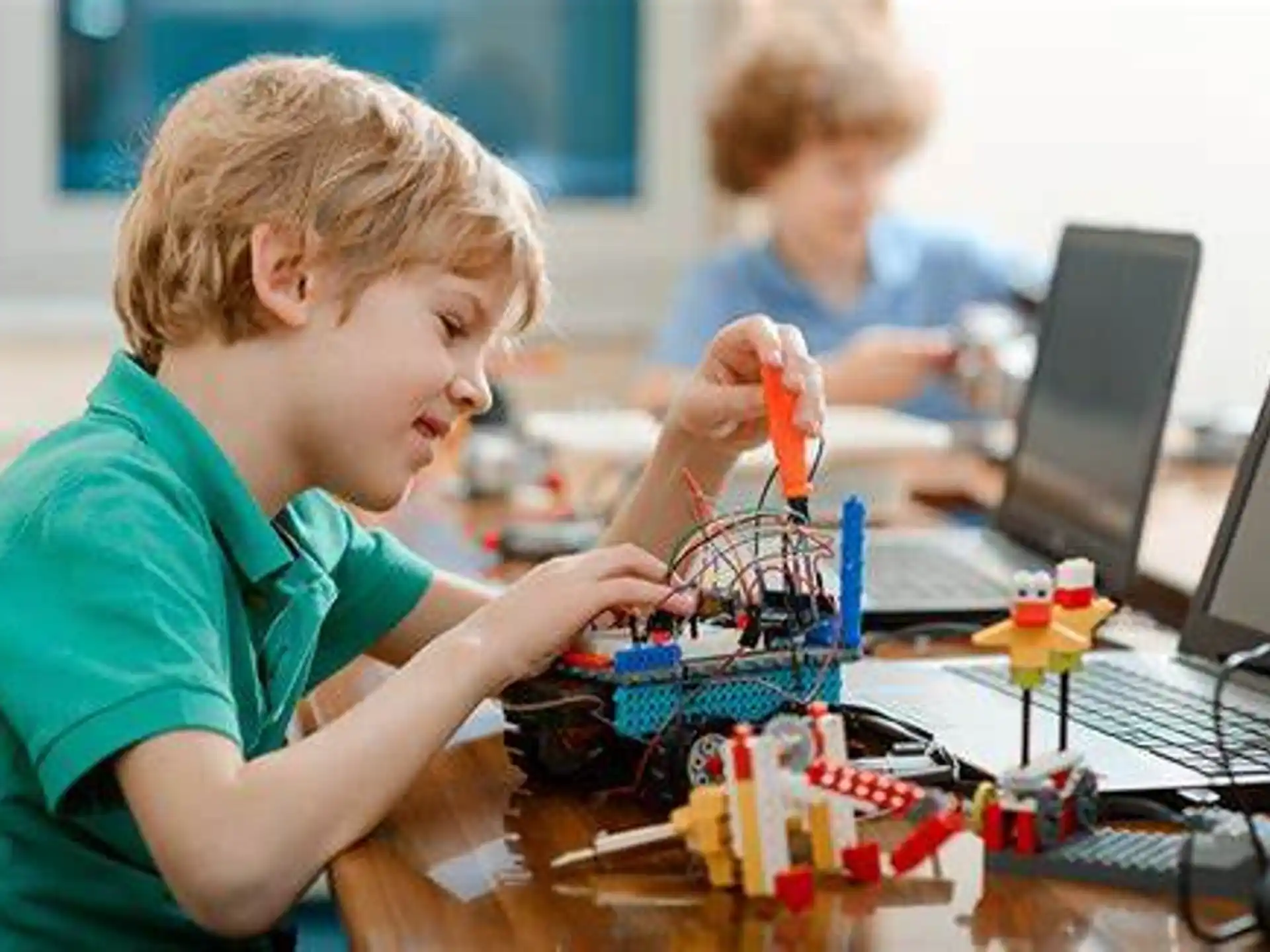a young boy playing with a toy