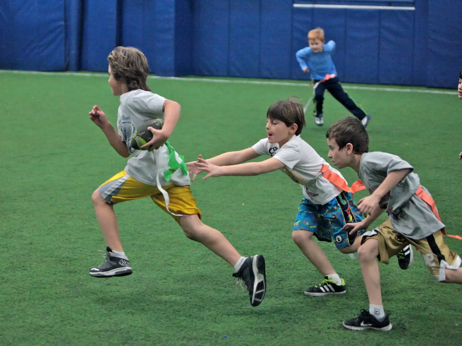 a group of boys playing rugby