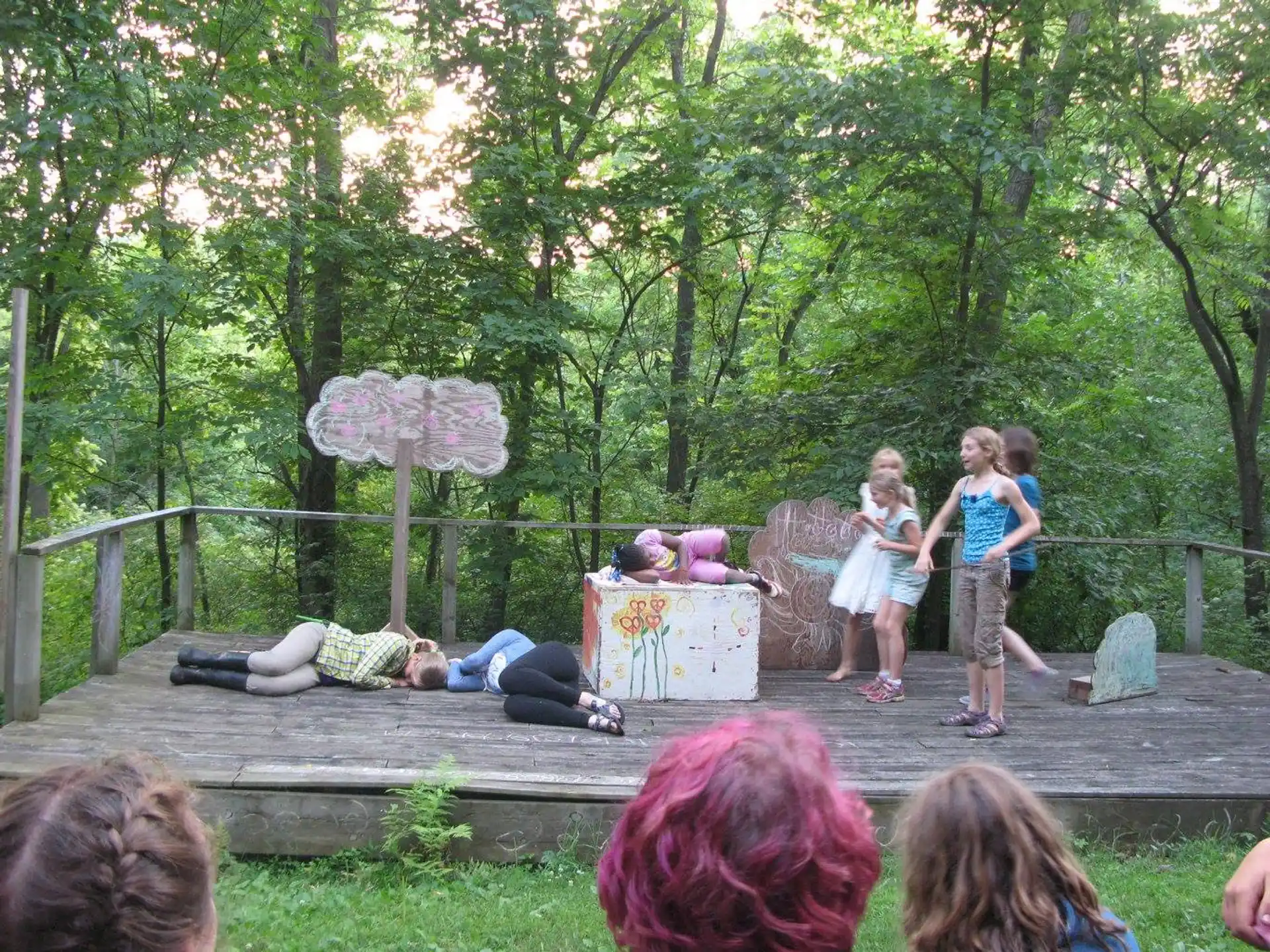 a group of children playing on a bench