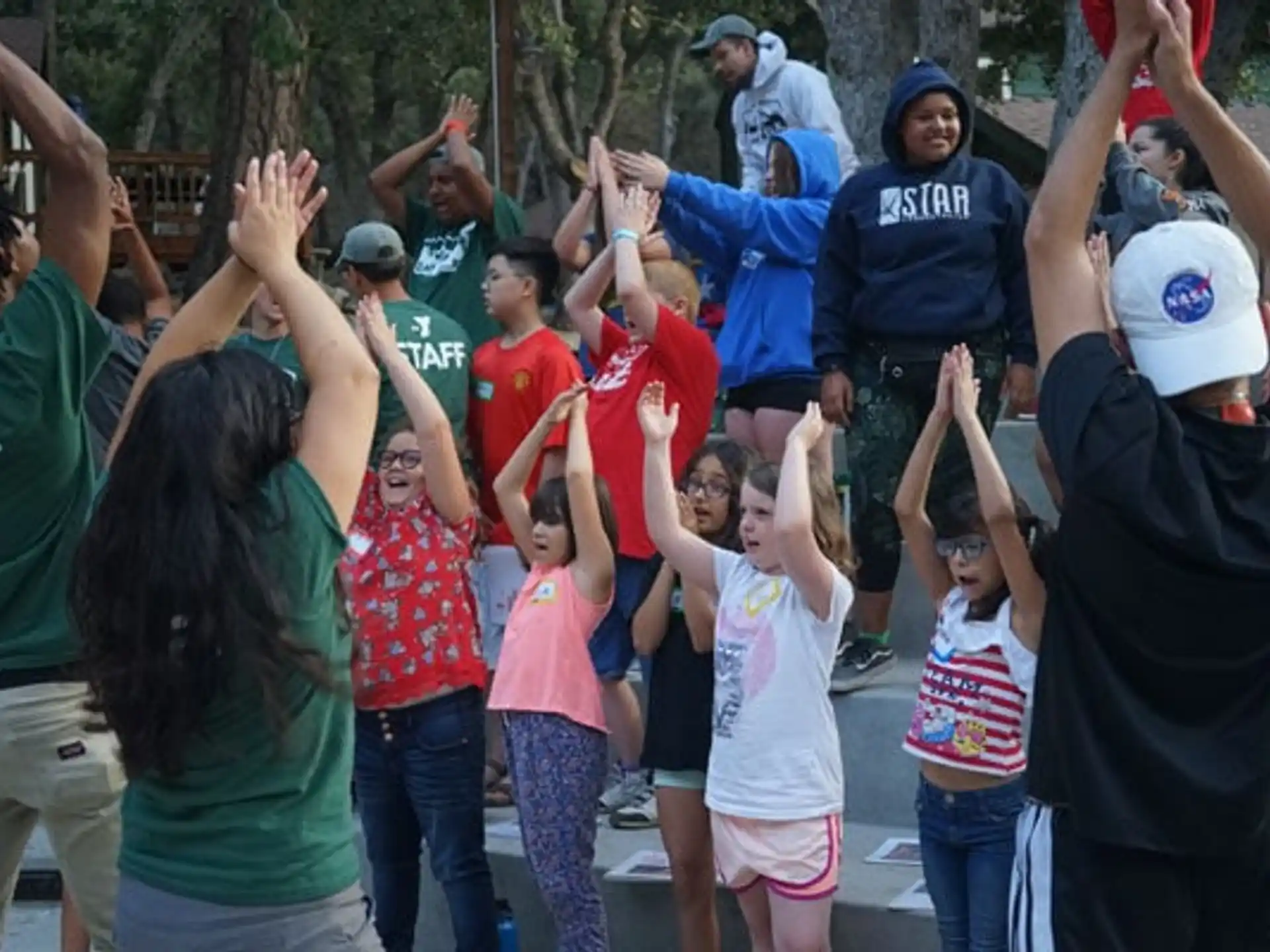 a group of people raising their hands