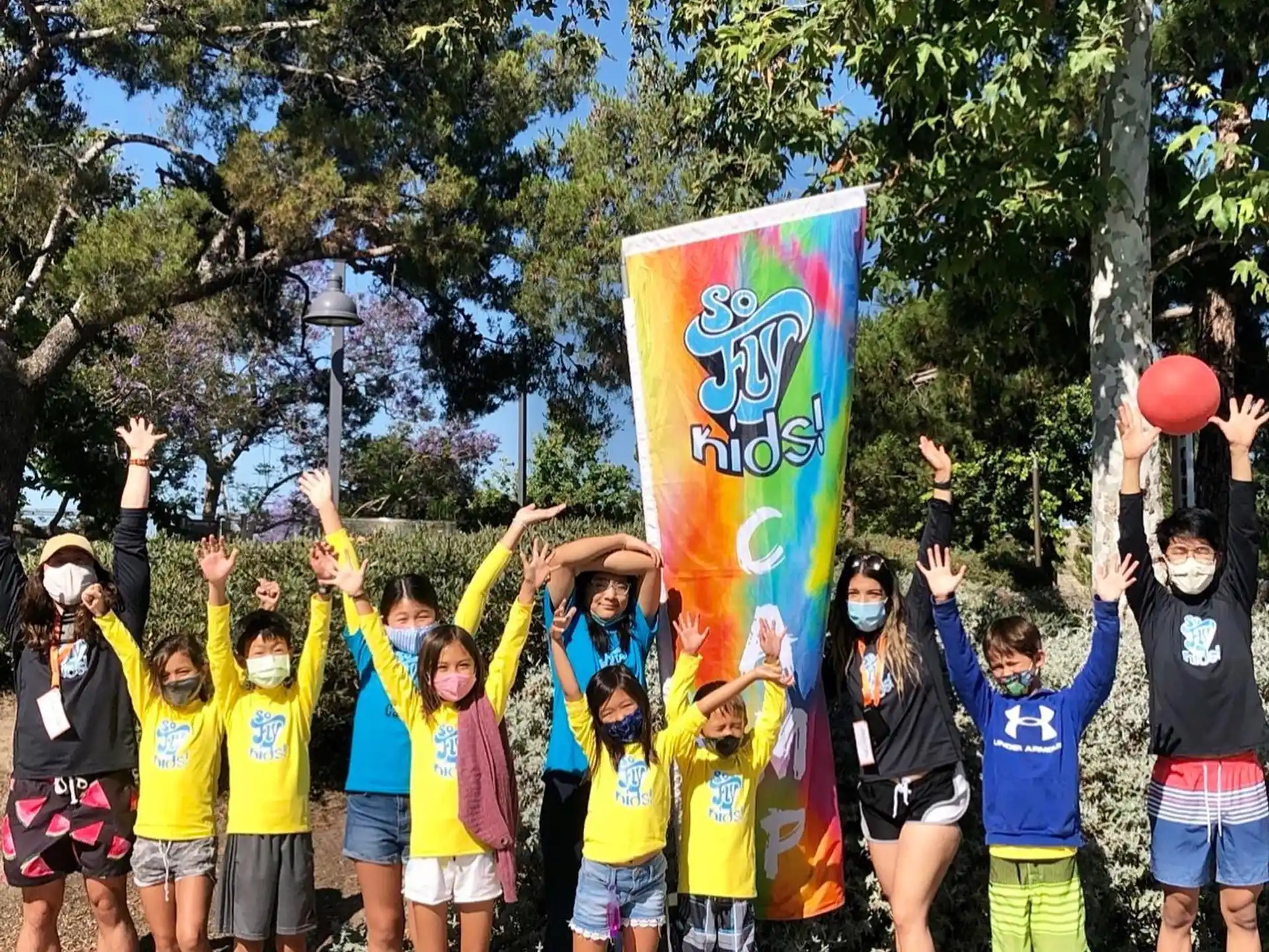 a group of children holding a flag