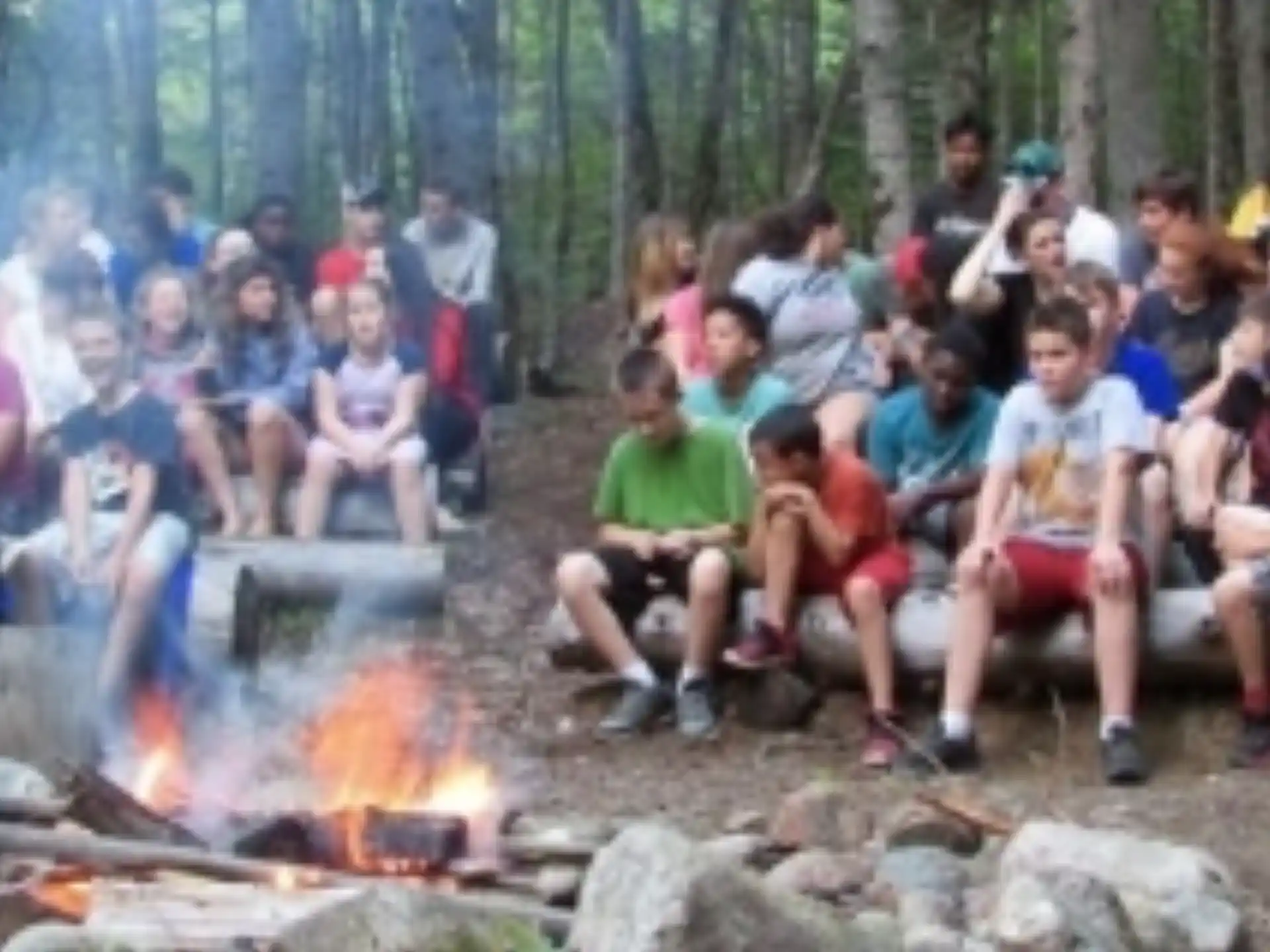 a group of people sitting around a campfire