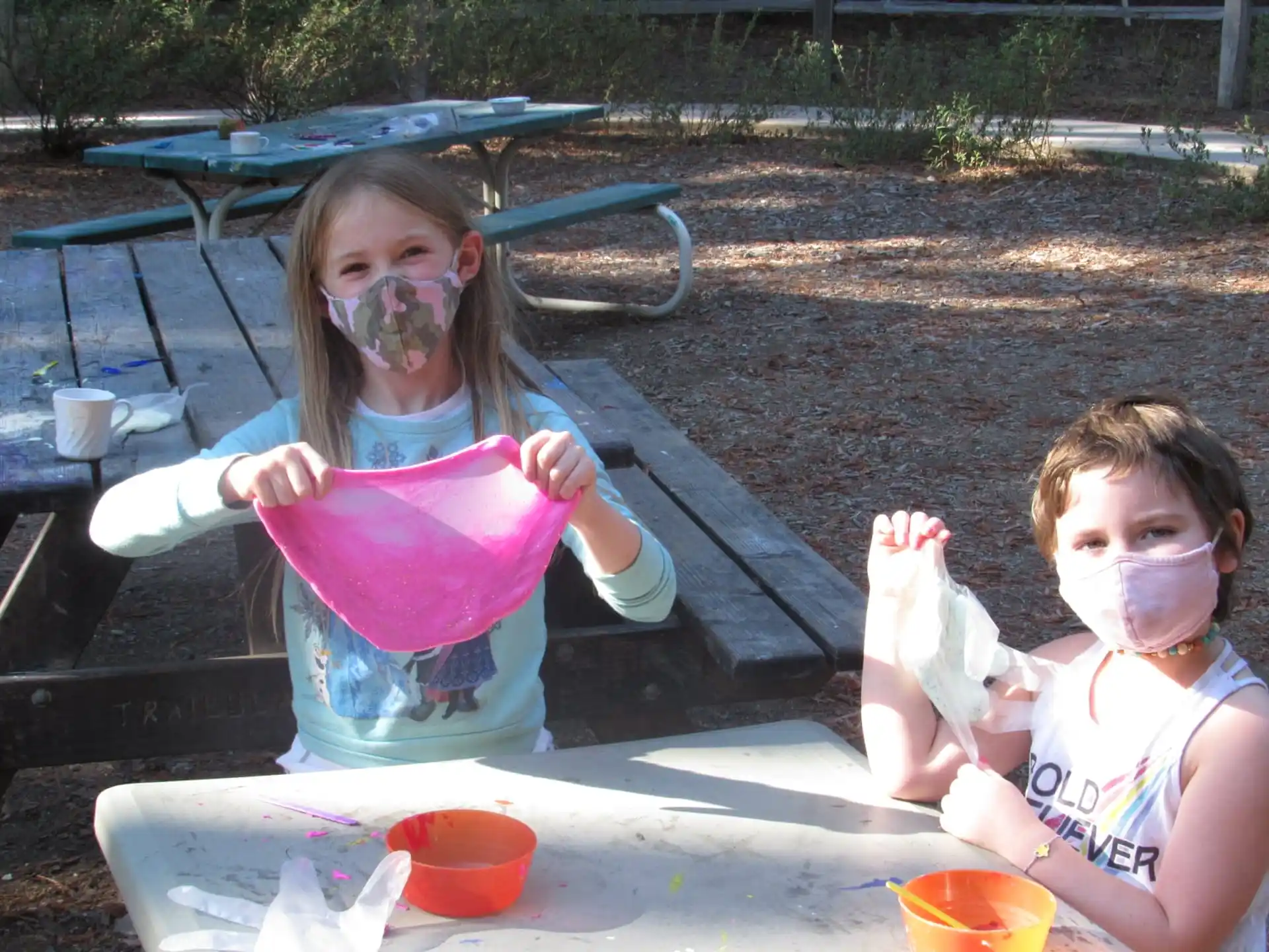 a couple of children with paint on their faces