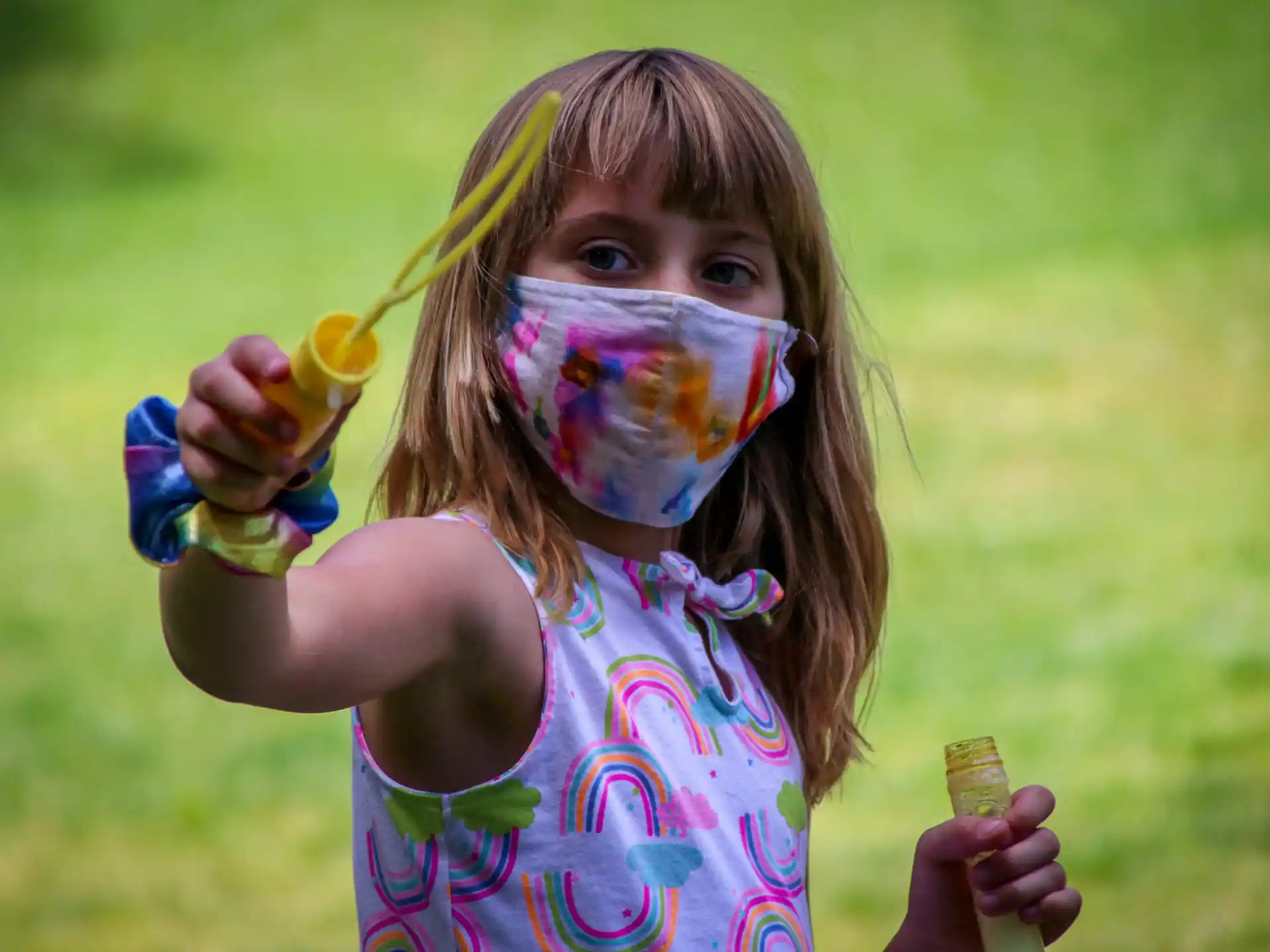 a girl holding a paintbrush