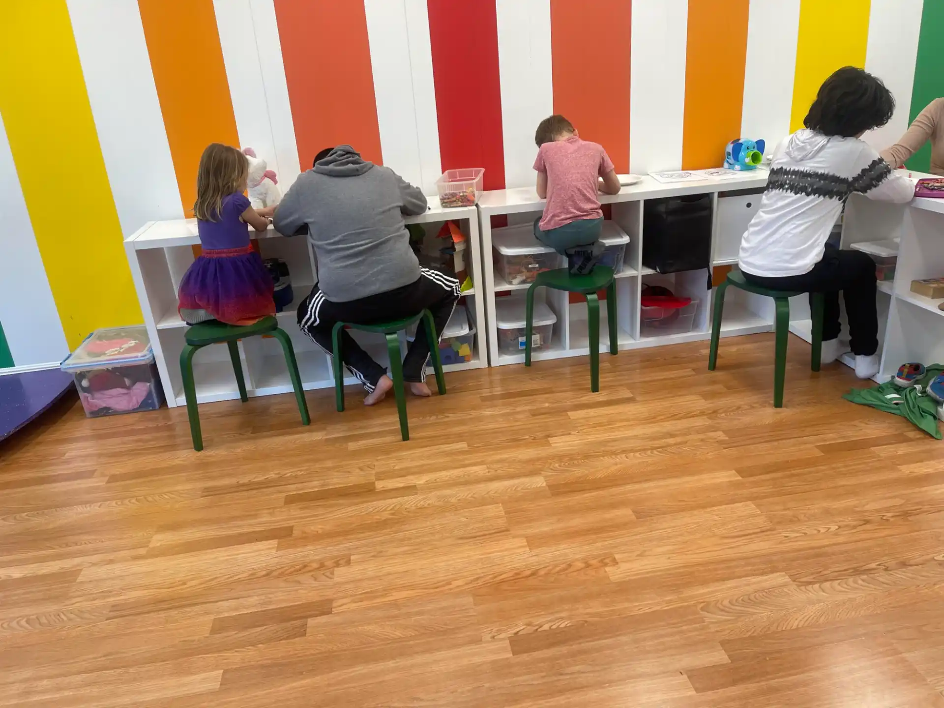 a group of people sitting at desks in a room