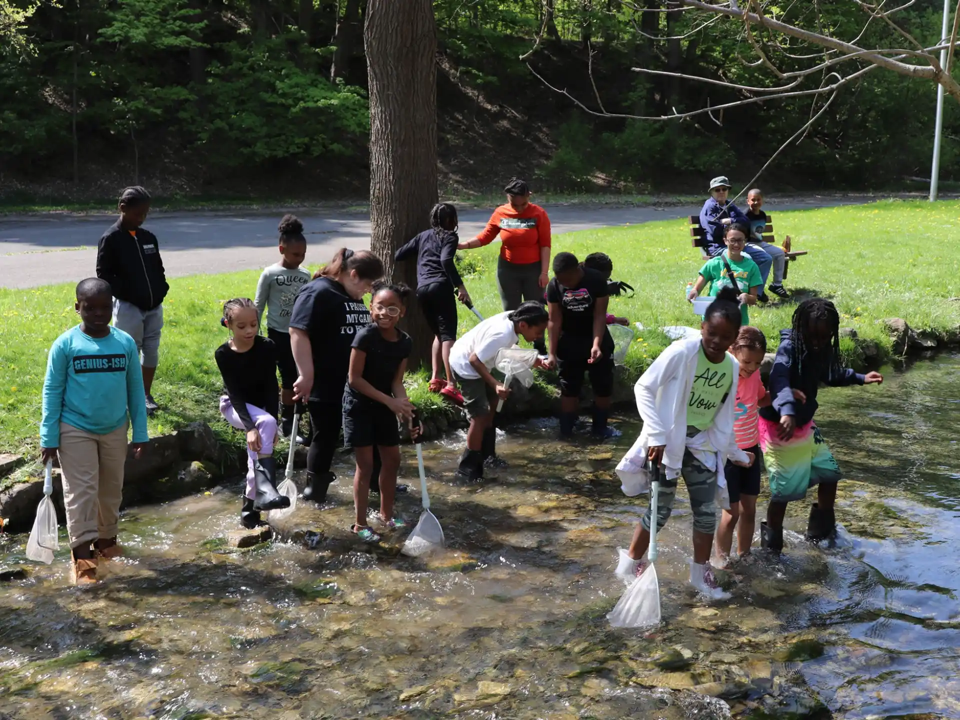 a group of people standing in a muddy area
