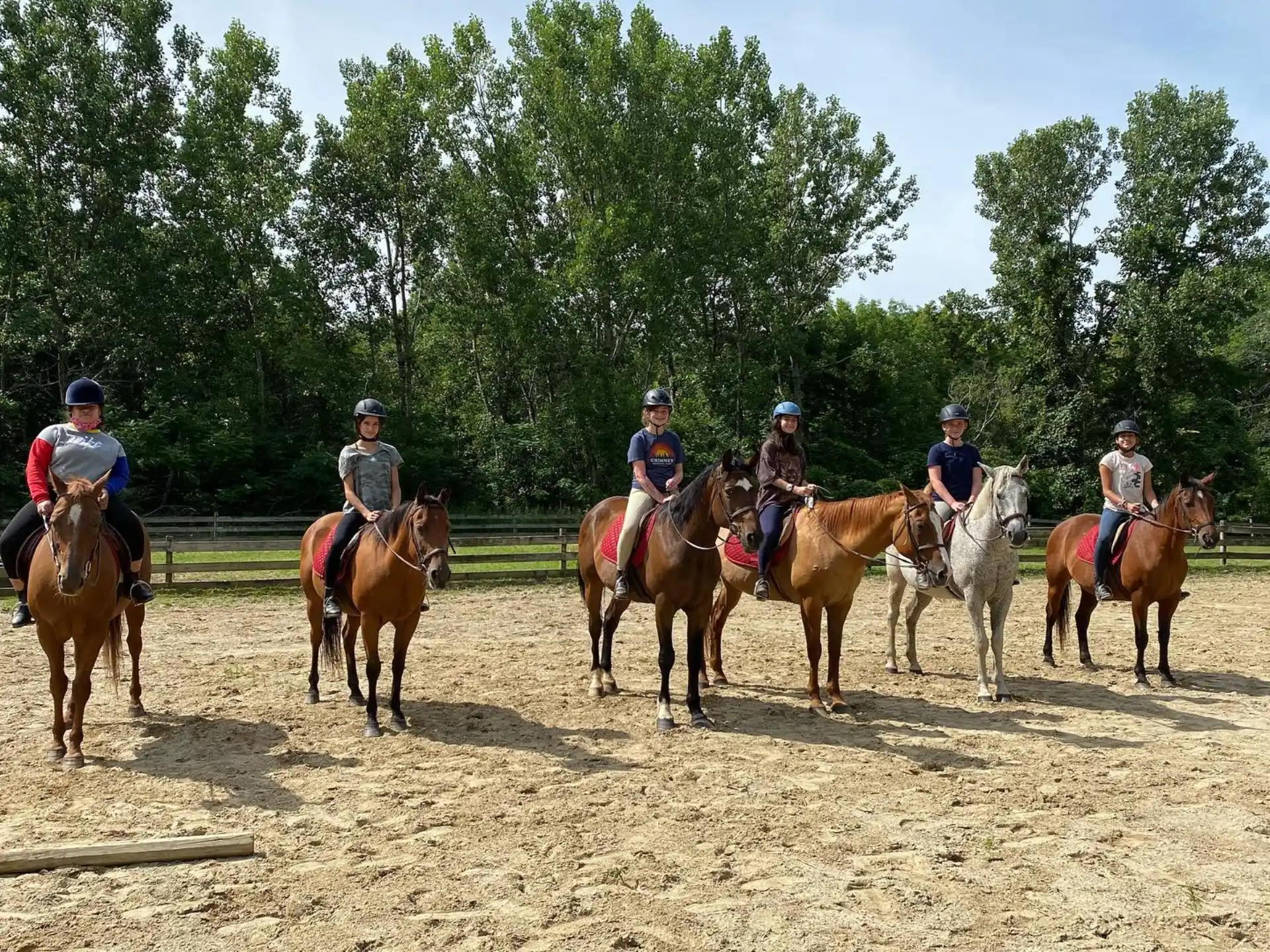 a group of people riding horses