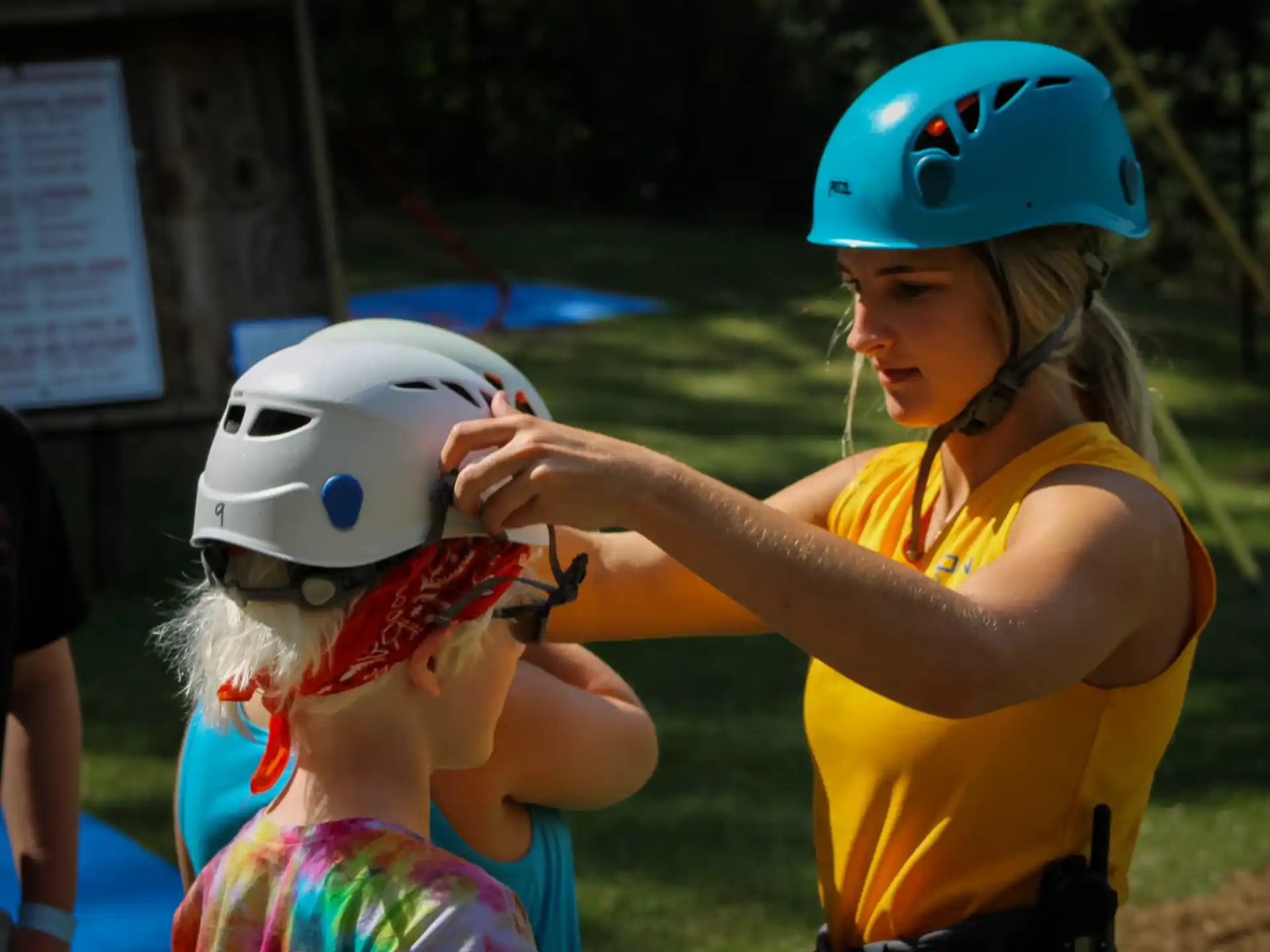 a person wearing a helmet and a child wearing a garment
