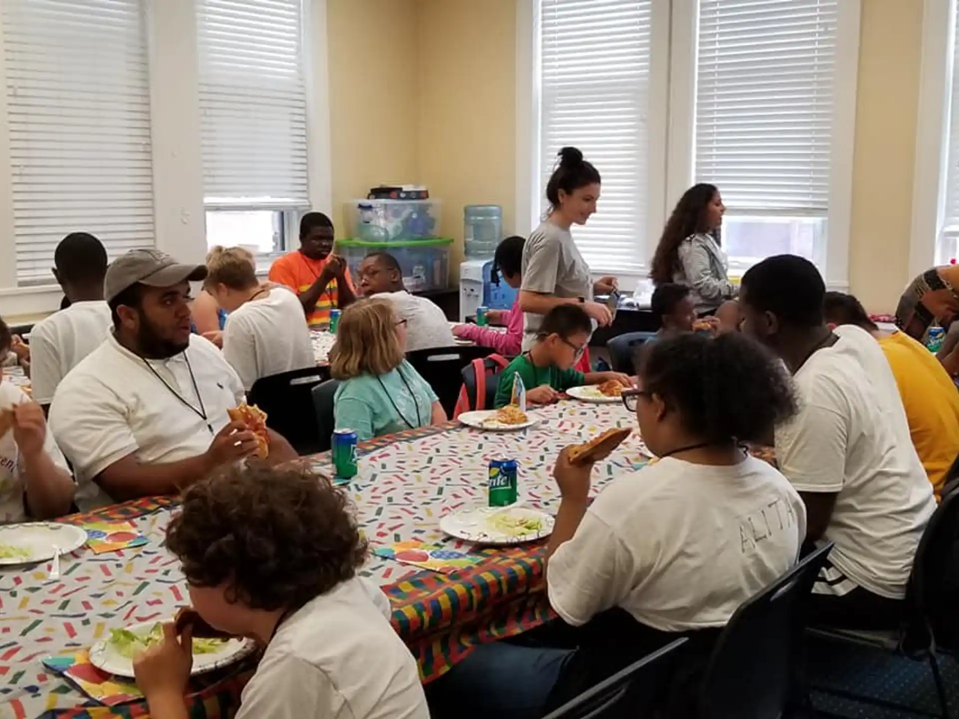 a group of people eating at a table