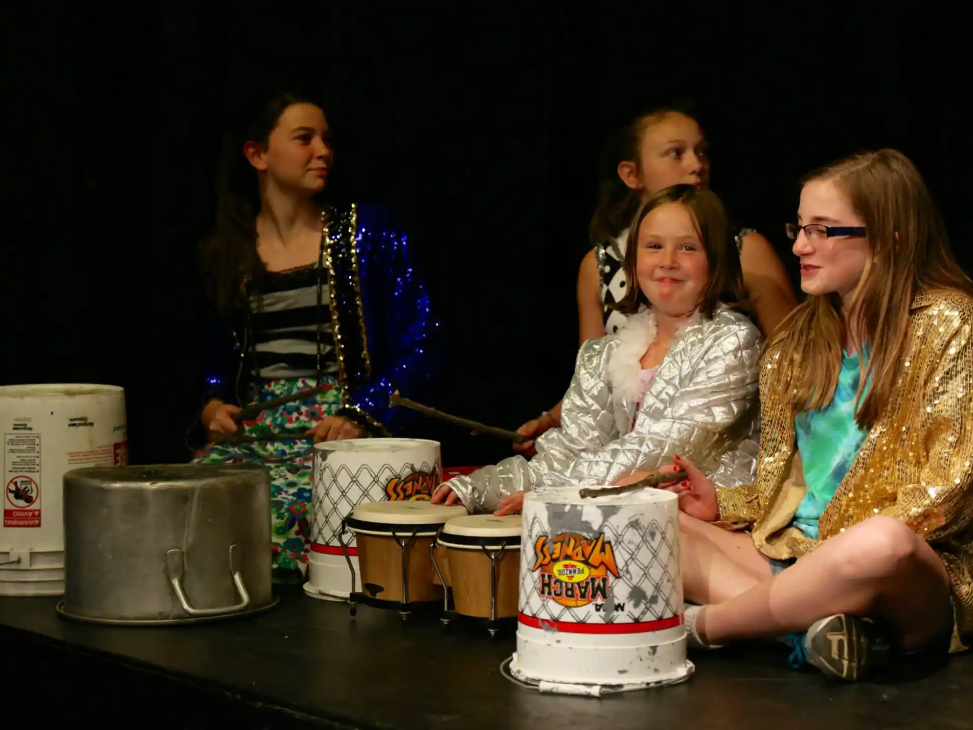 a group of women playing drums
