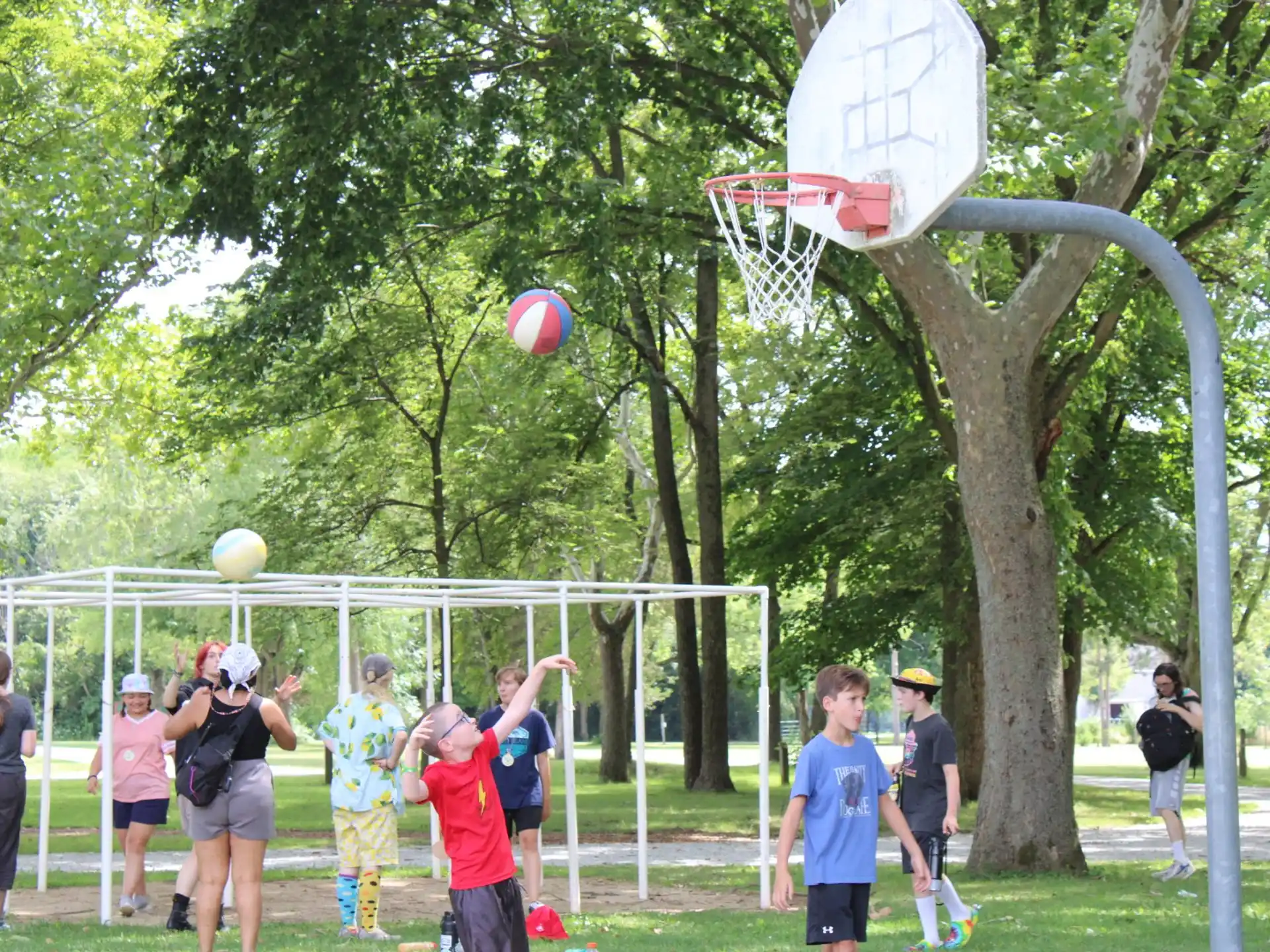 a group of people playing volleyball