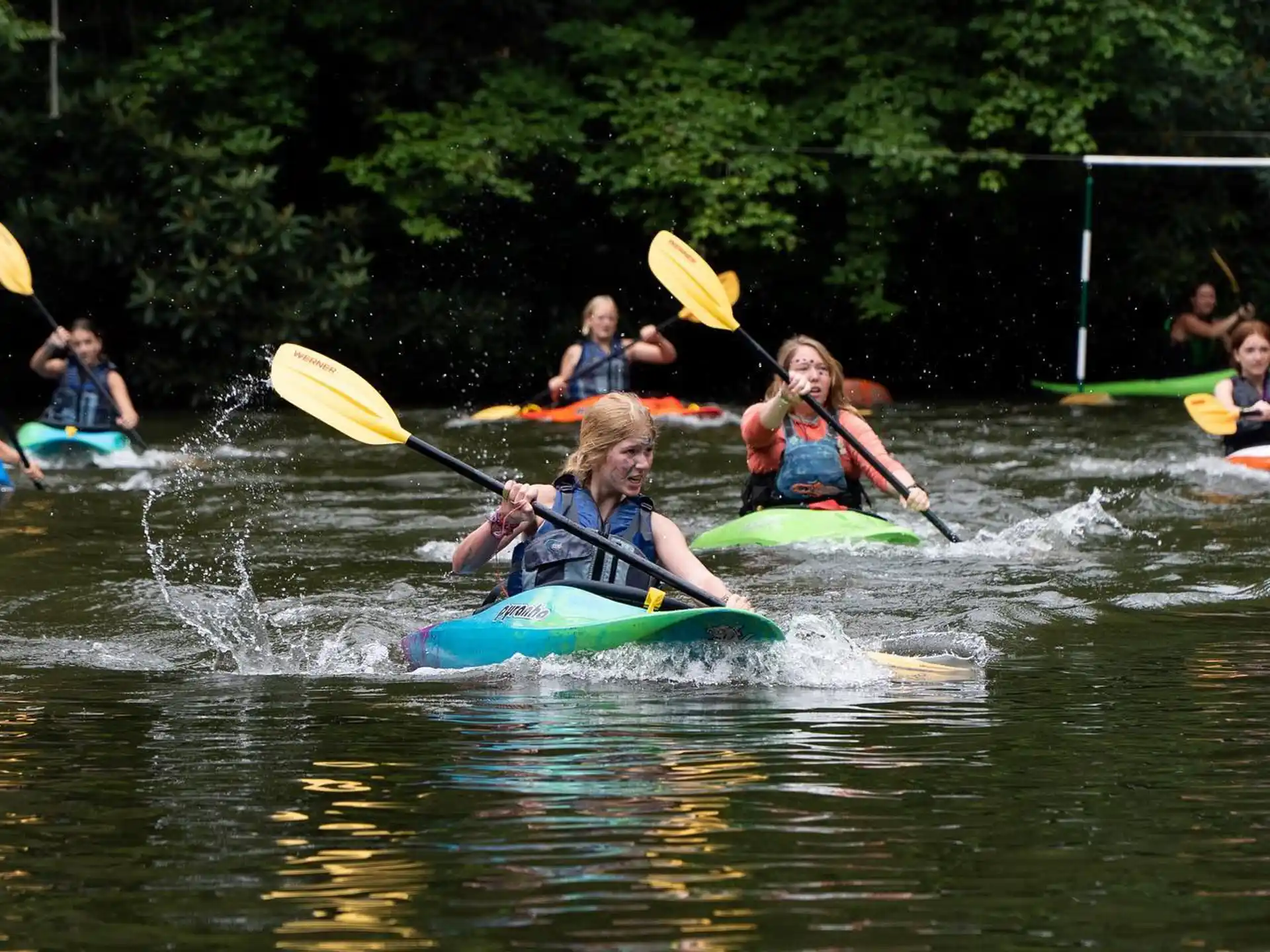 a group of people in kayaks