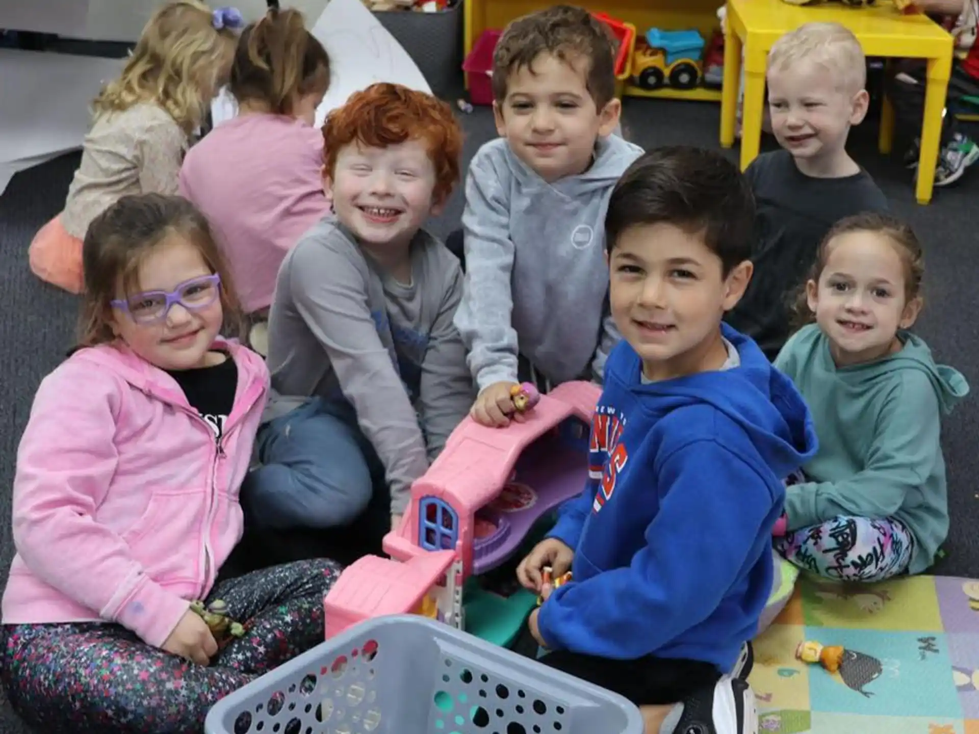 a group of children sitting on the floor
