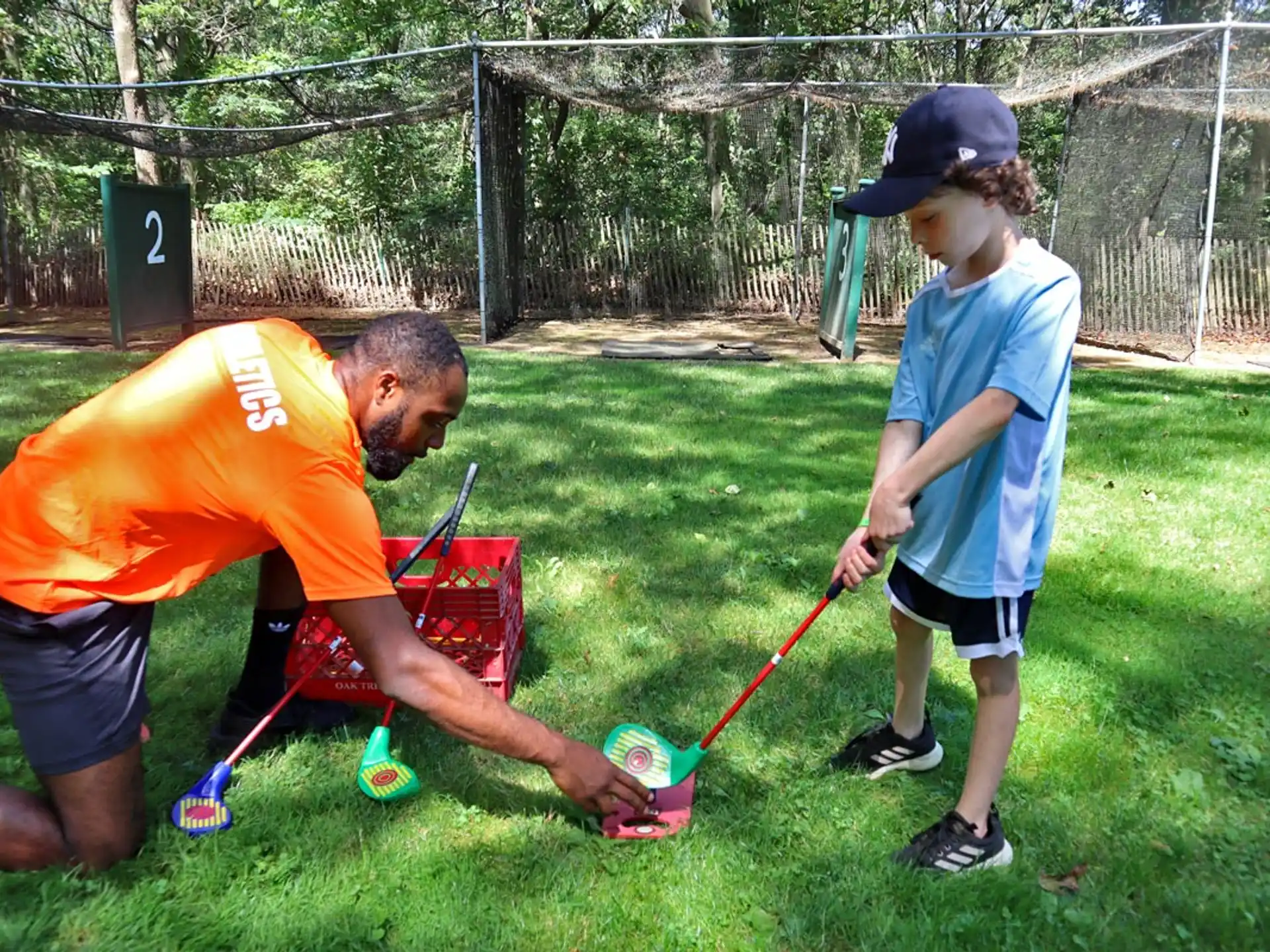 a person and a boy playing with a toy