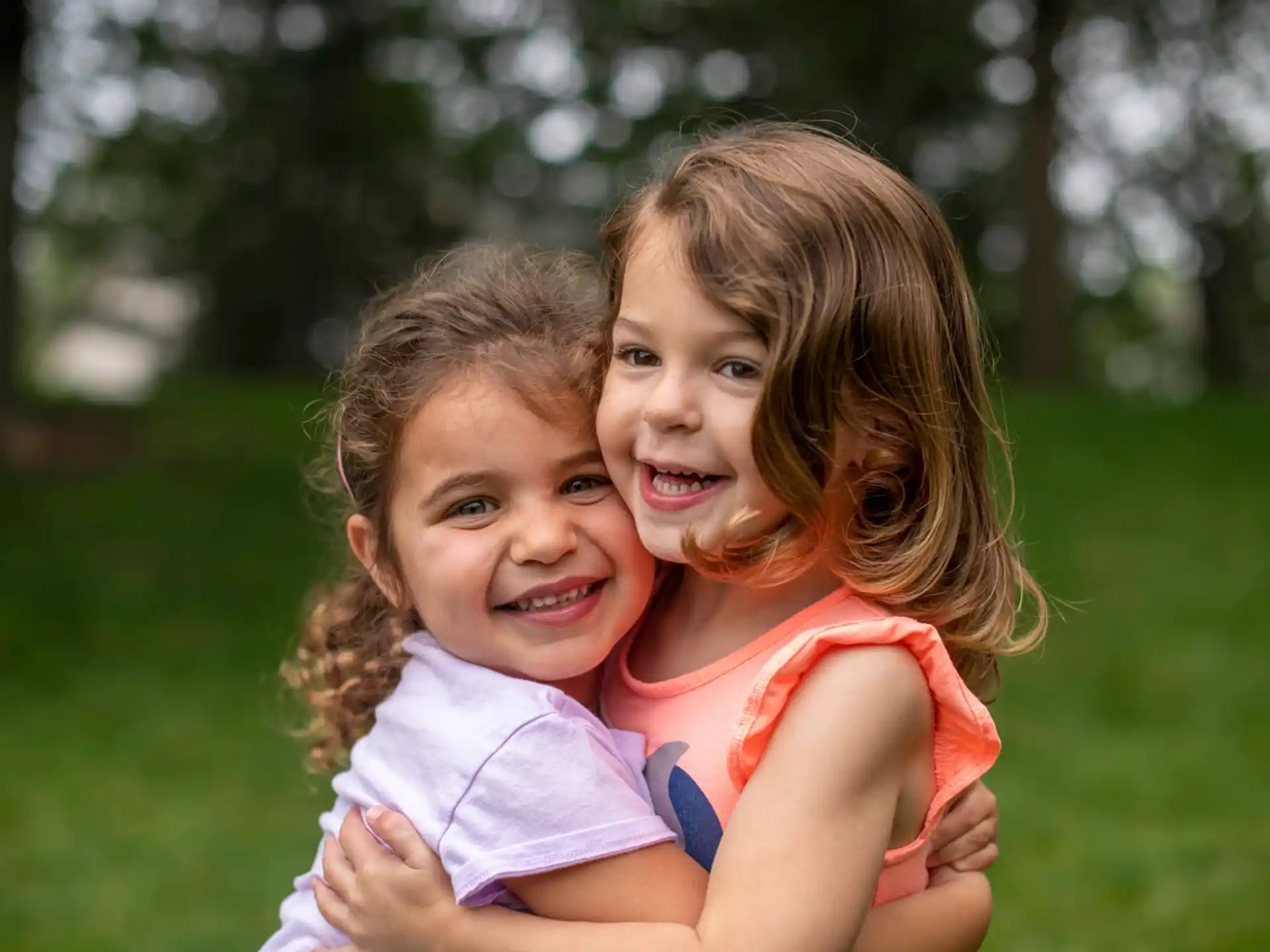 a couple of girls hugging