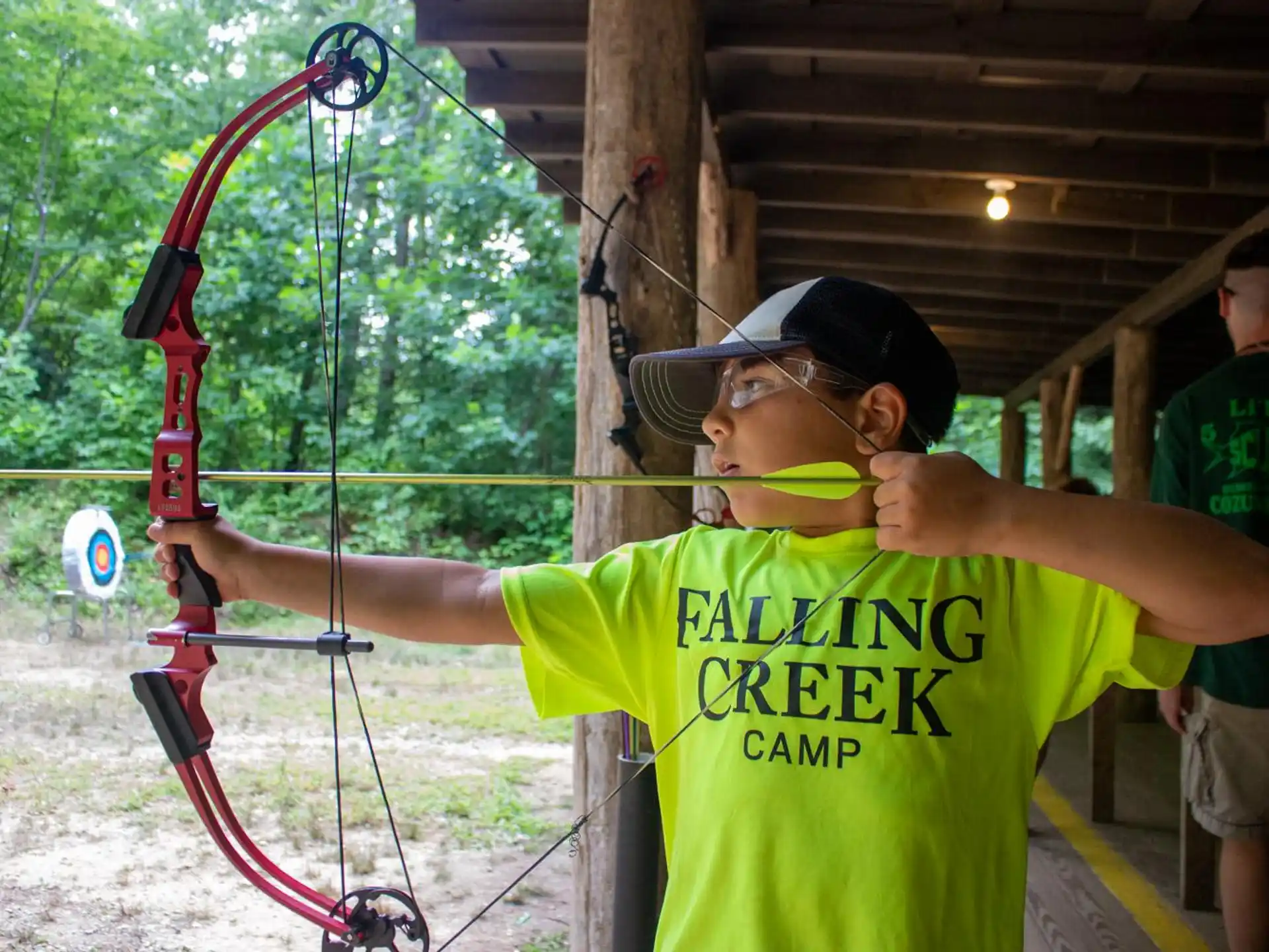 a boy holding a bow and arrow