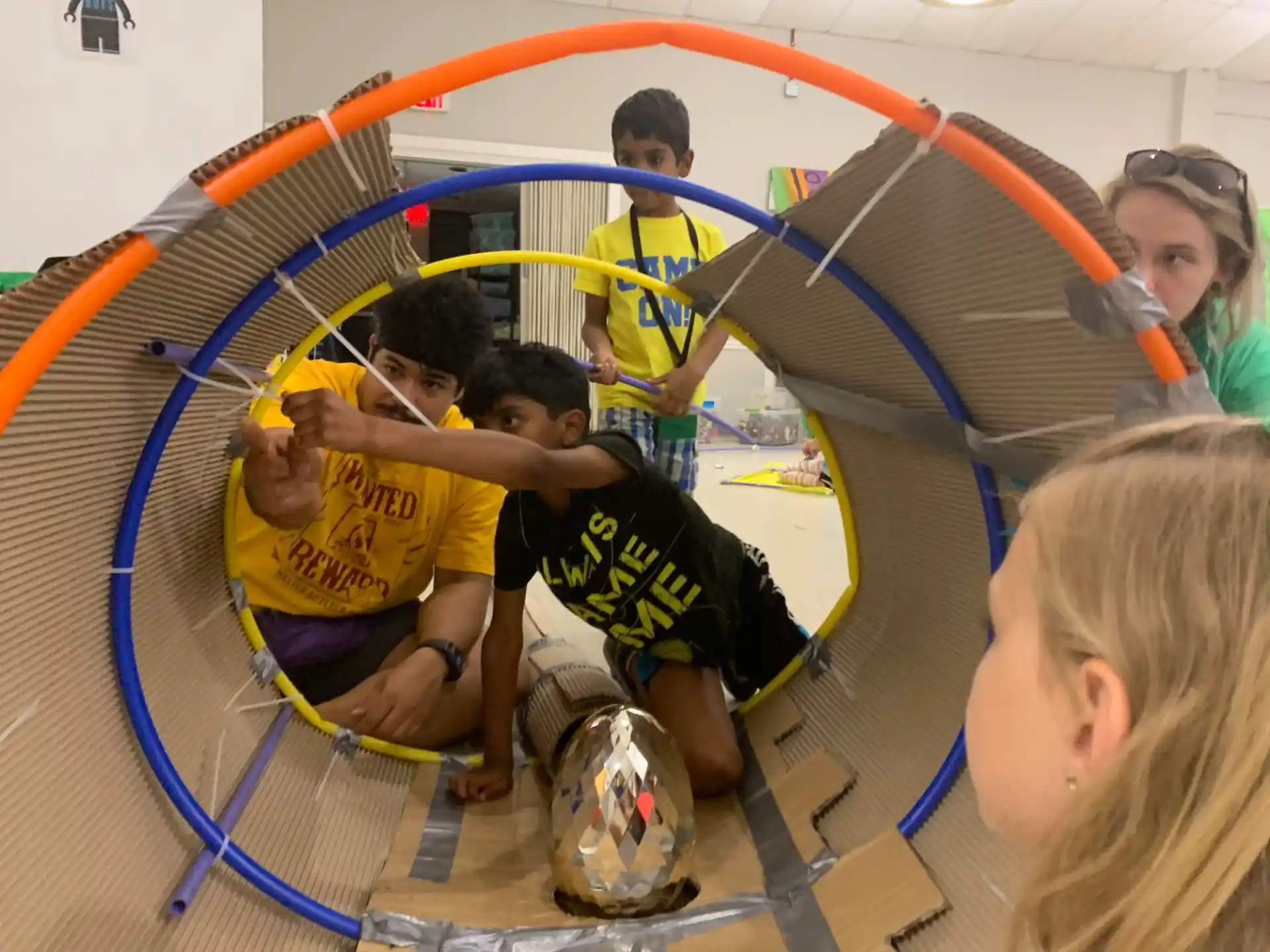 a group of kids playing in a gym