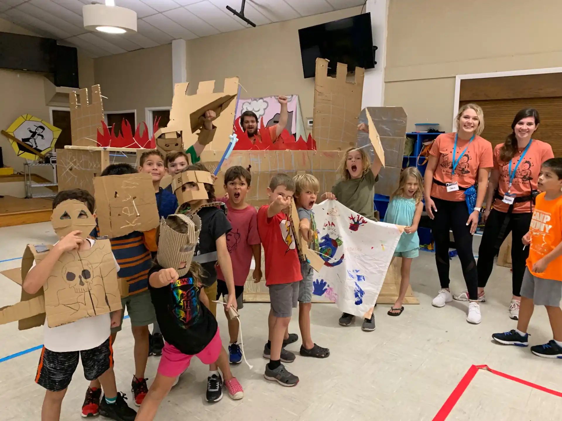 a group of people wearing cardboard boxes