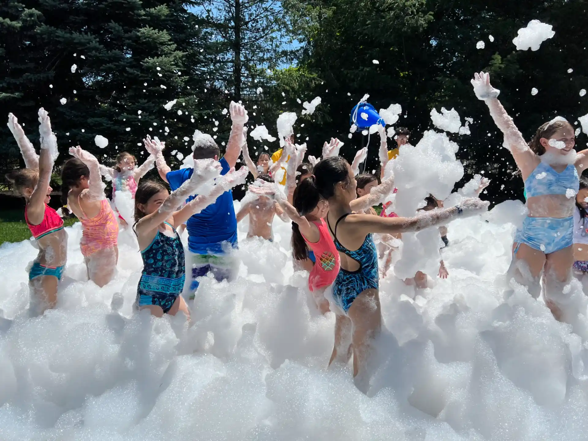 a group of children jumping in the air