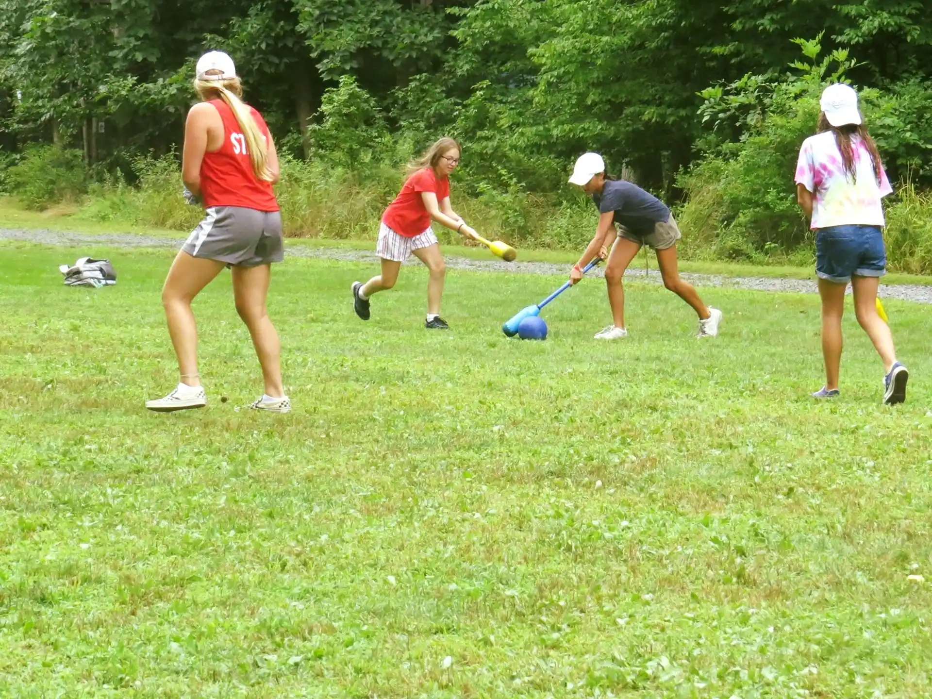 a group of people playing frisbee