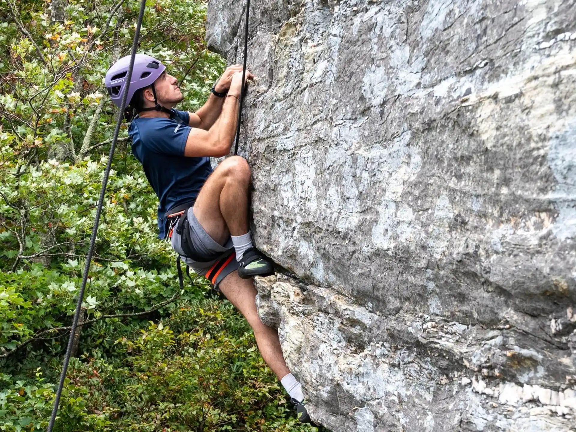 a man rock climbing