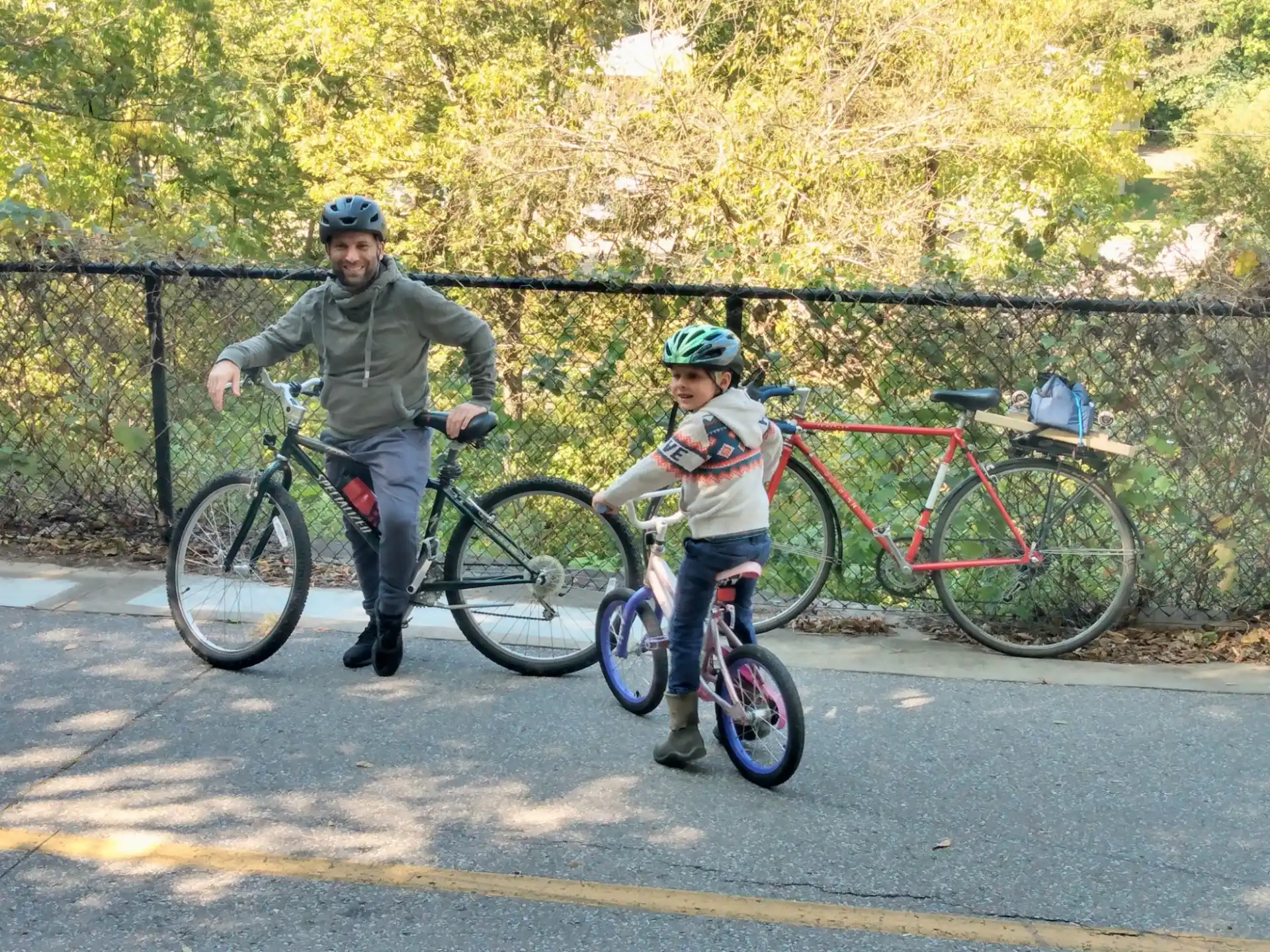 a person and a boy on bicycles