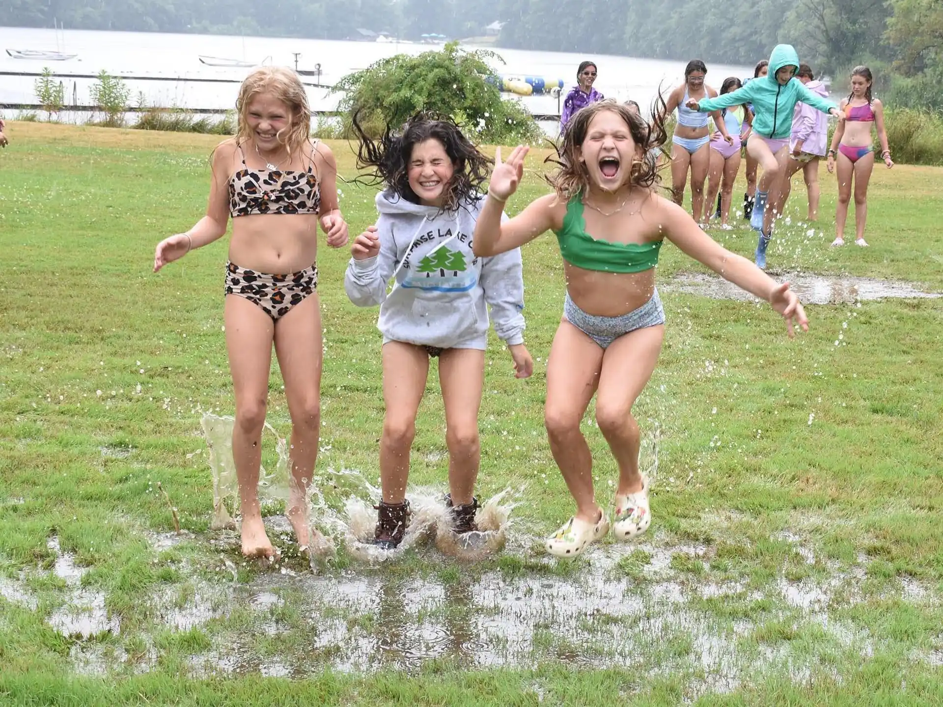 a group of girls running in a field