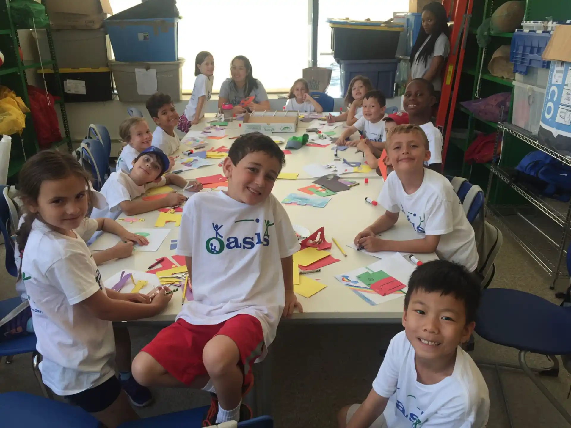 a group of children sitting at a table