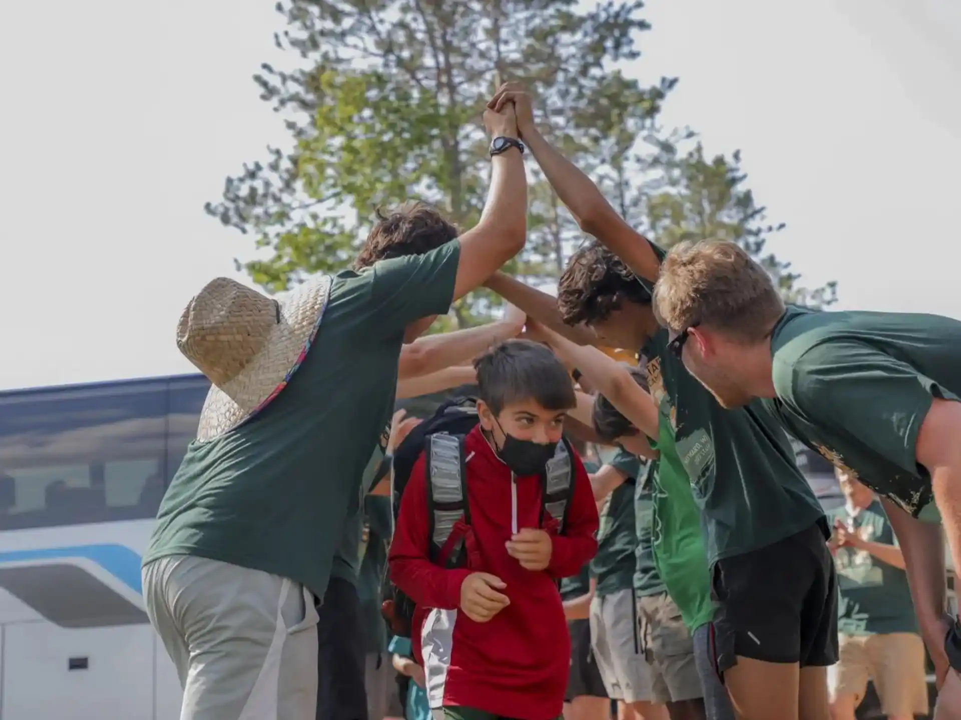 a group of people holding each other