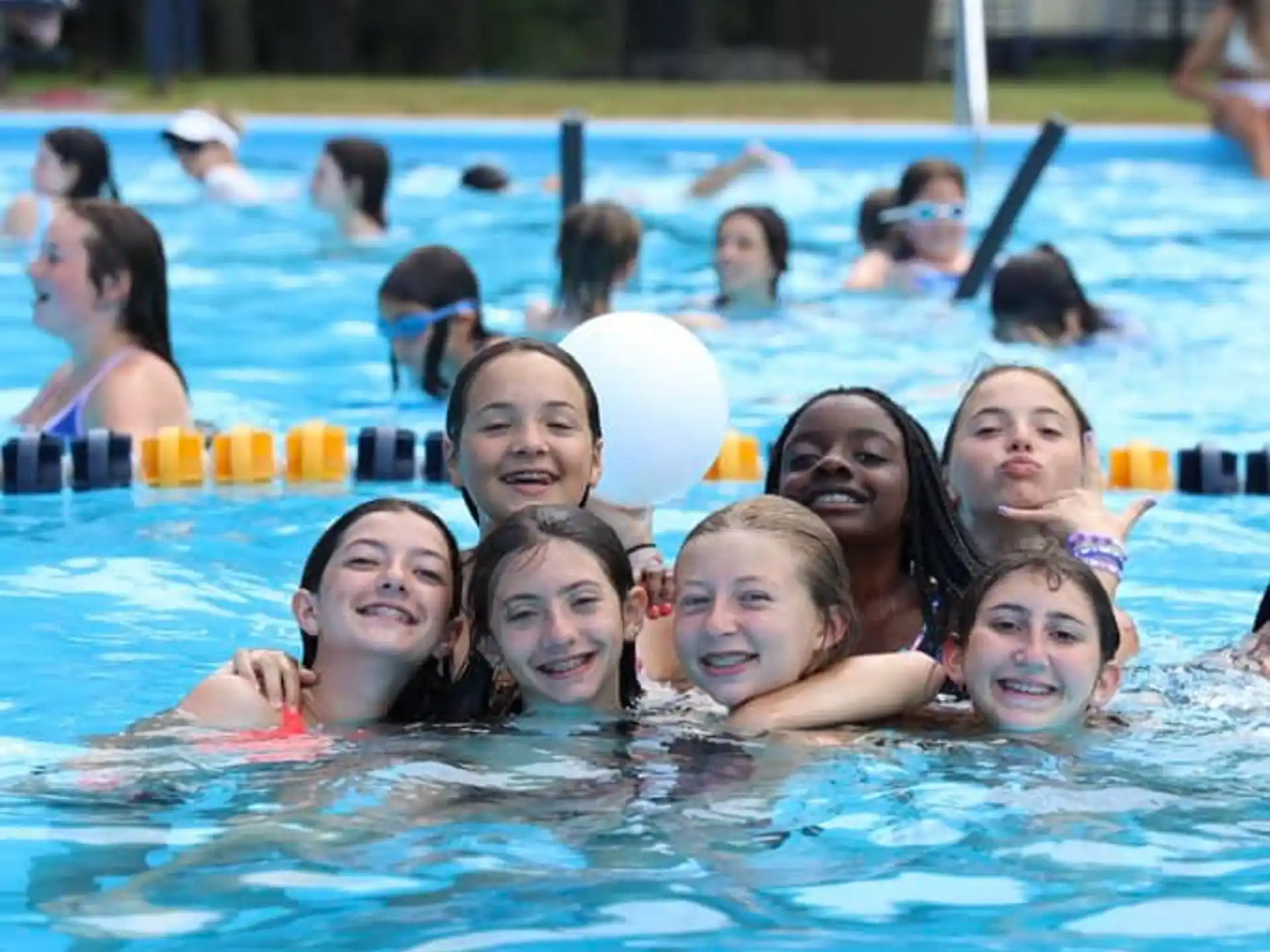 a group of people in a pool