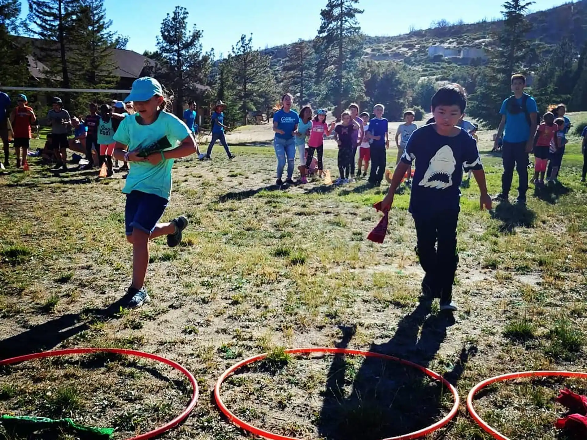a group of people playing with a rope