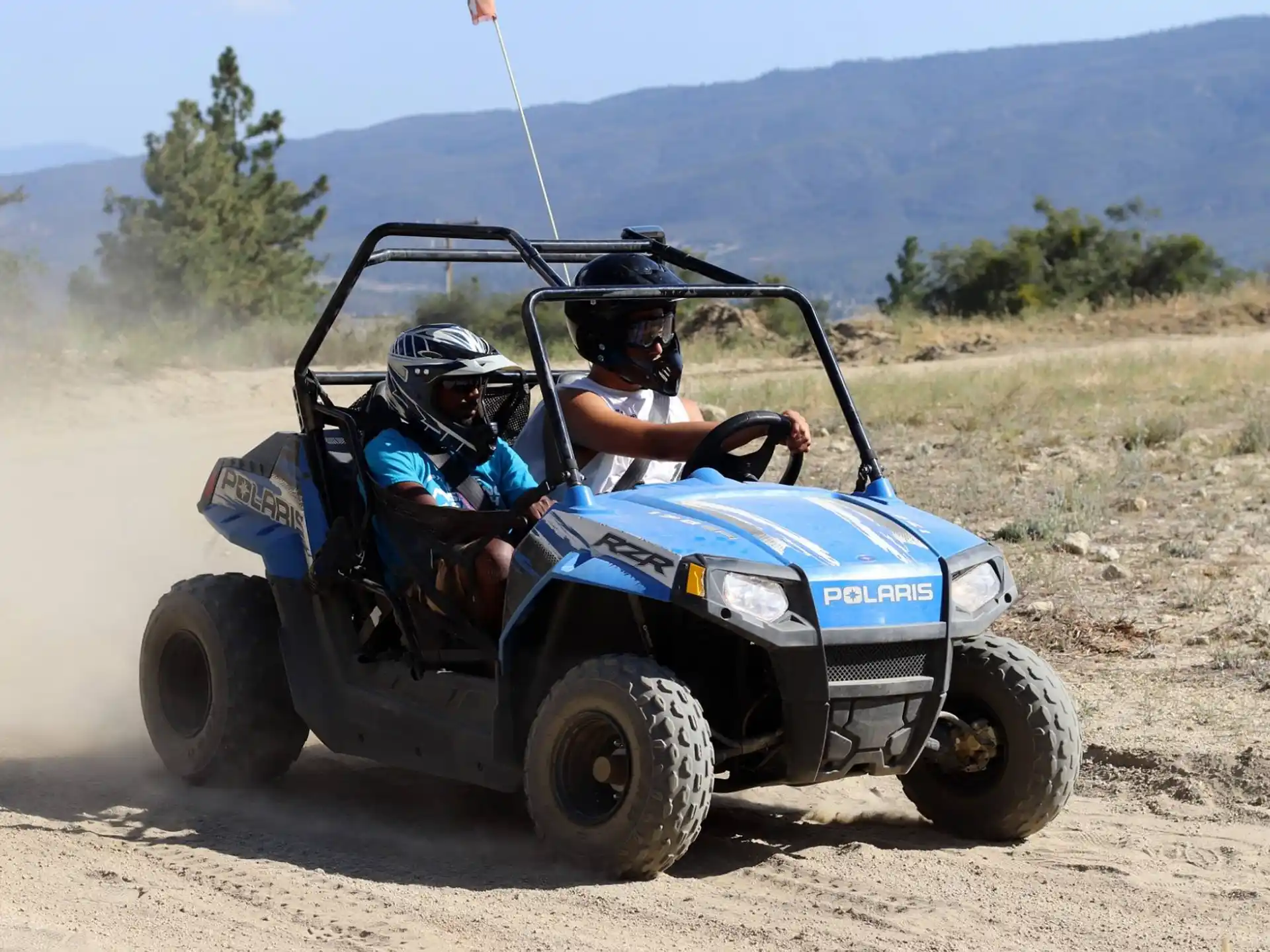 two people in a vehicle
