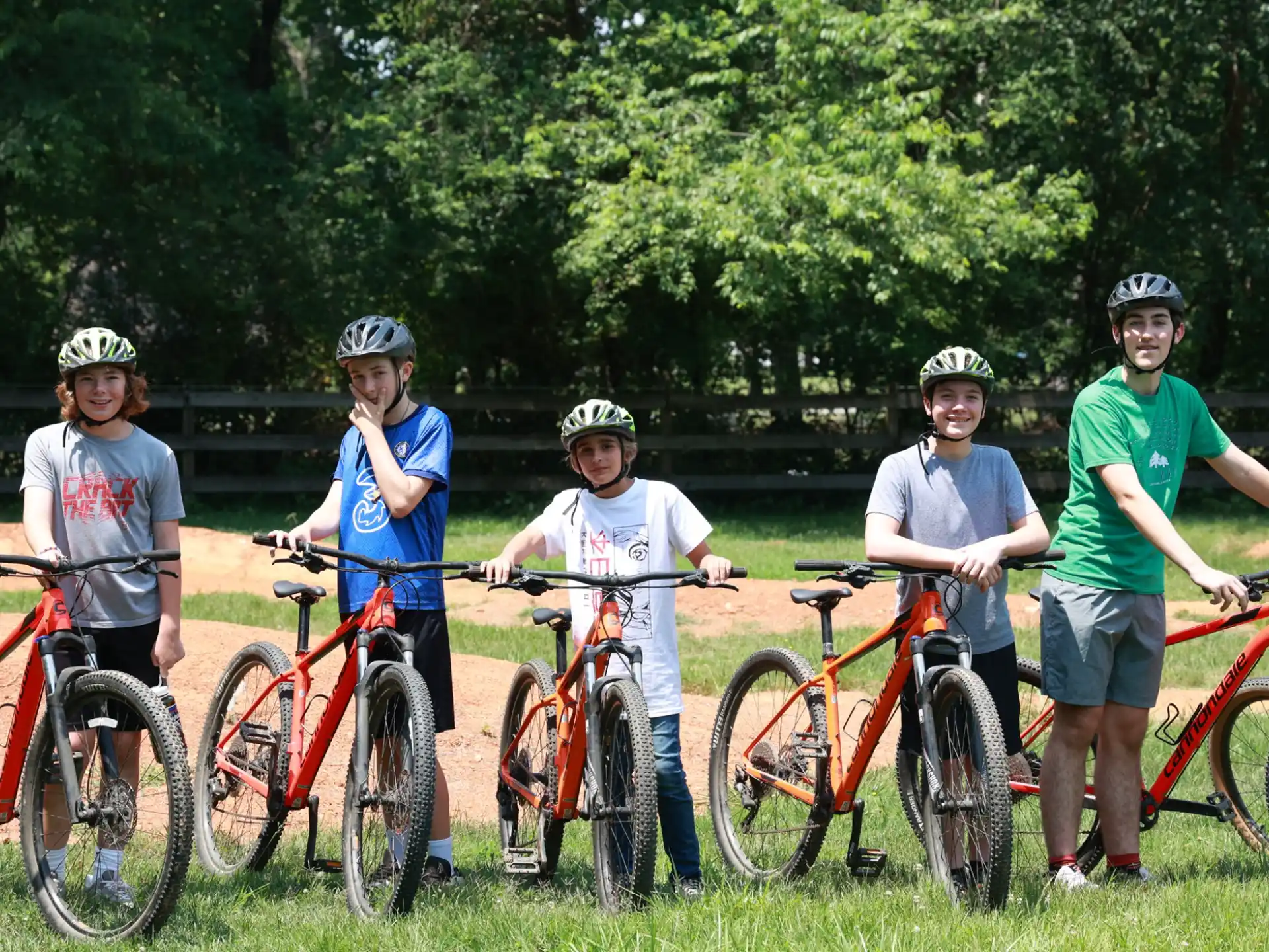 a group of people with bicycles
