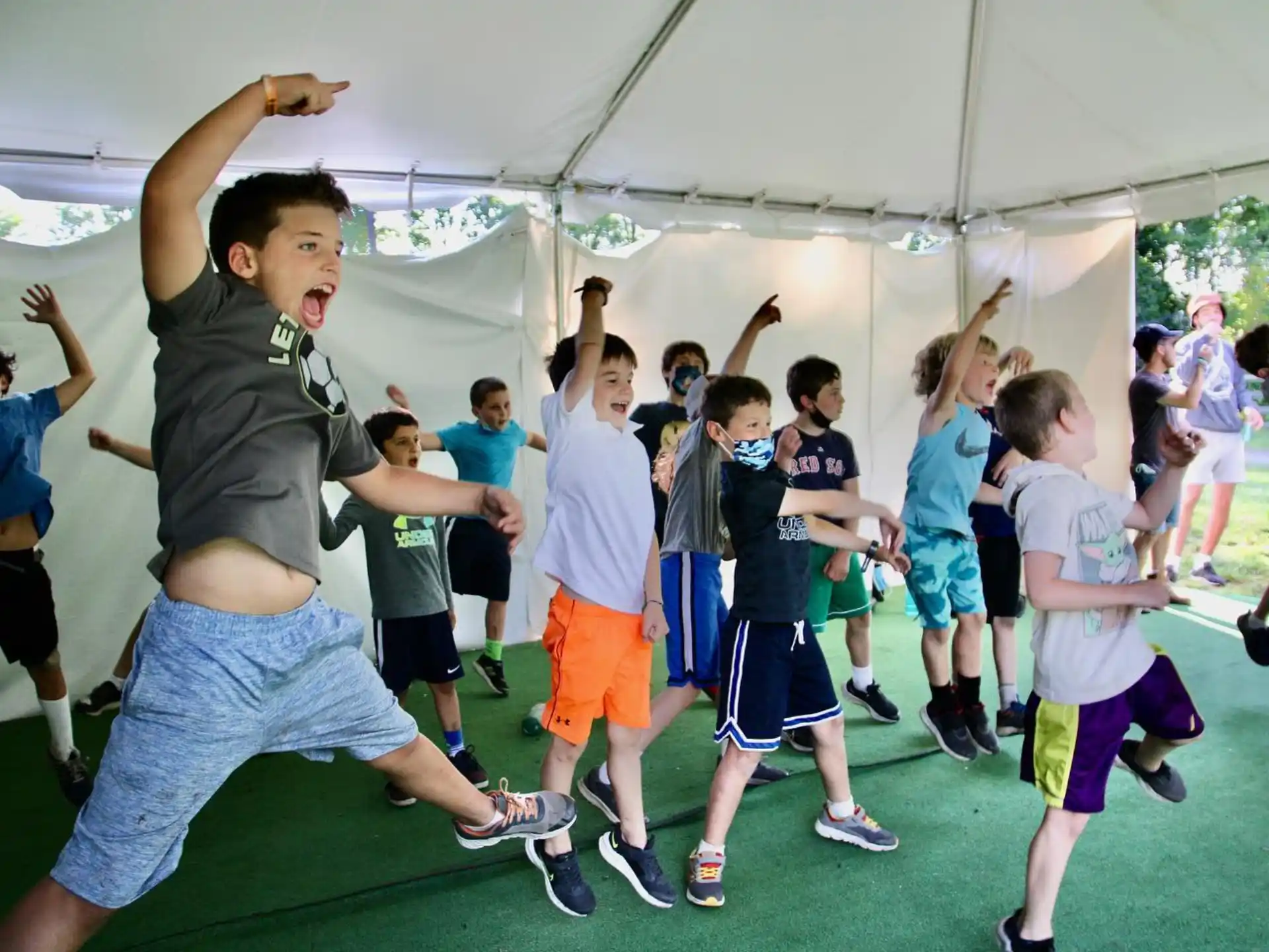 a group of kids jumping in the air
