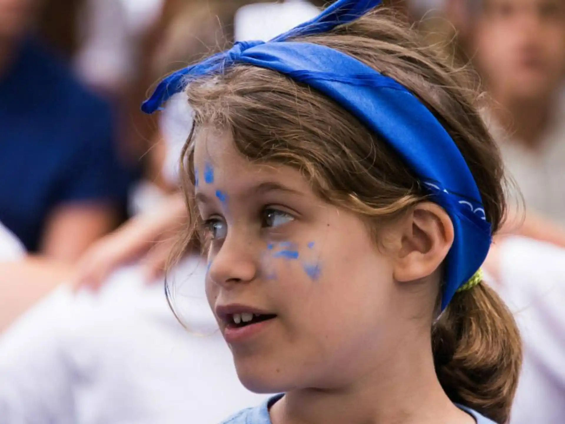 a woman with blue paint on her face