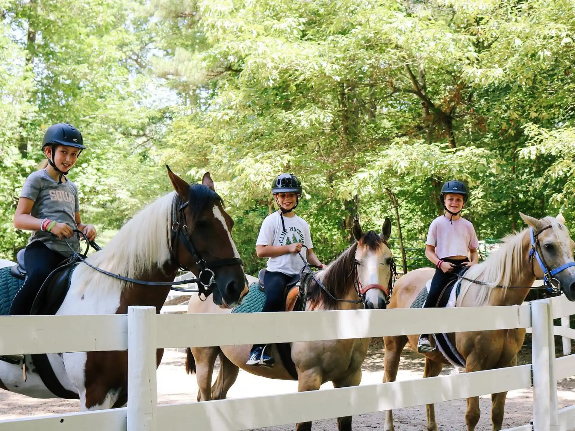 a group of people riding horses