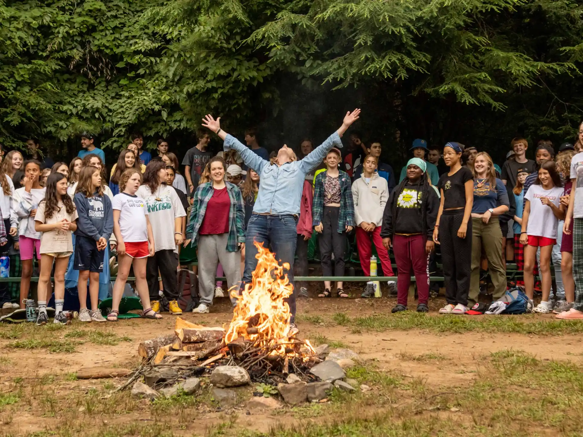 a group of people around a fire