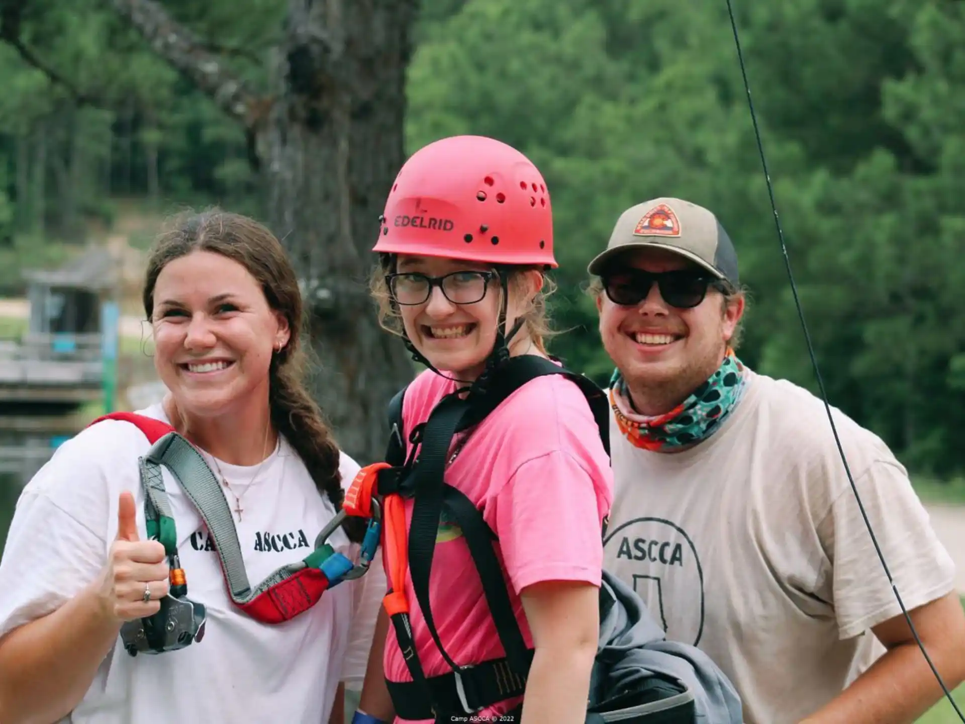 a group of people wearing helmets and smiling at the camera