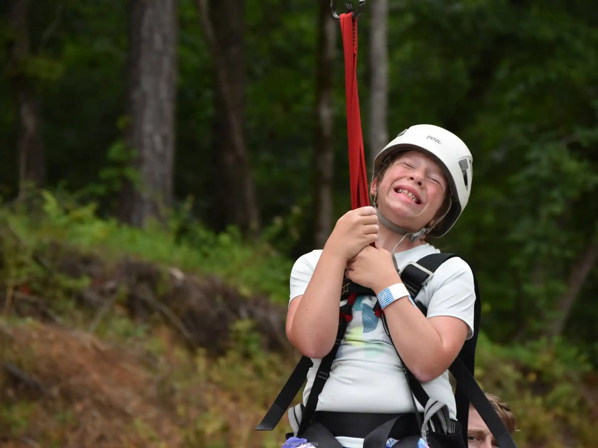 a person wearing a helmet and holding a bow and arrow