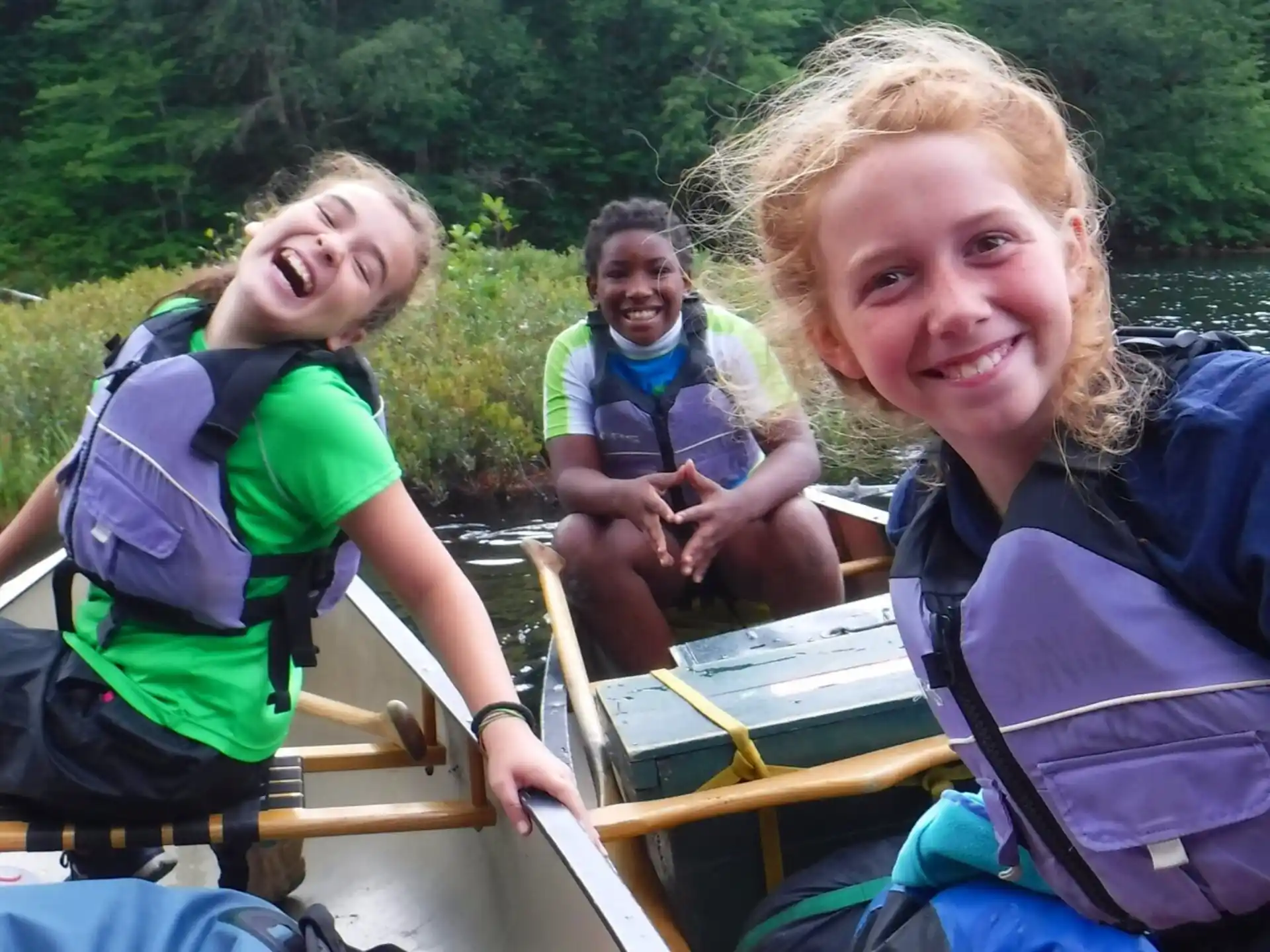 a group of people in a canoe