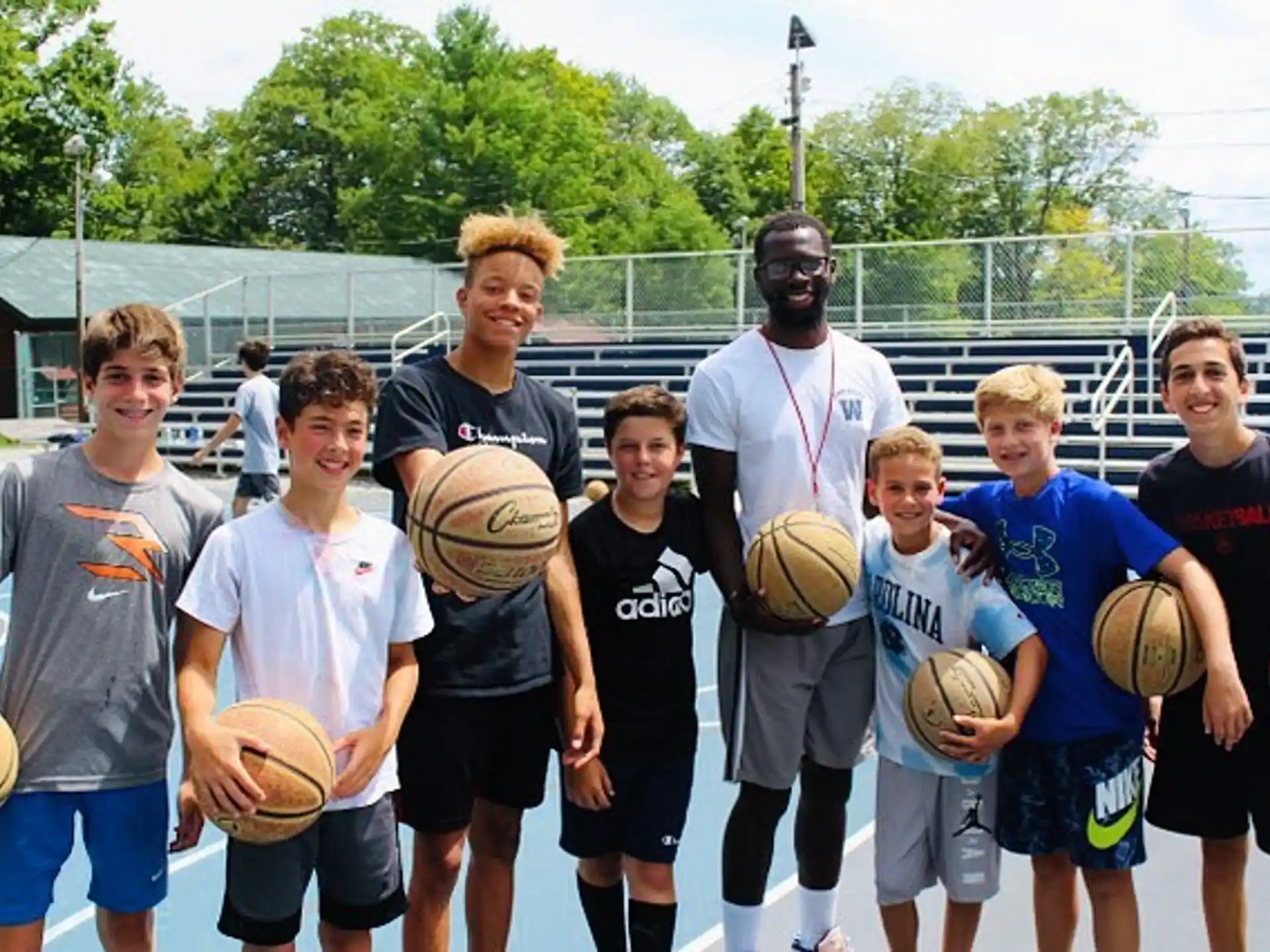 a group of boys holding basketballs