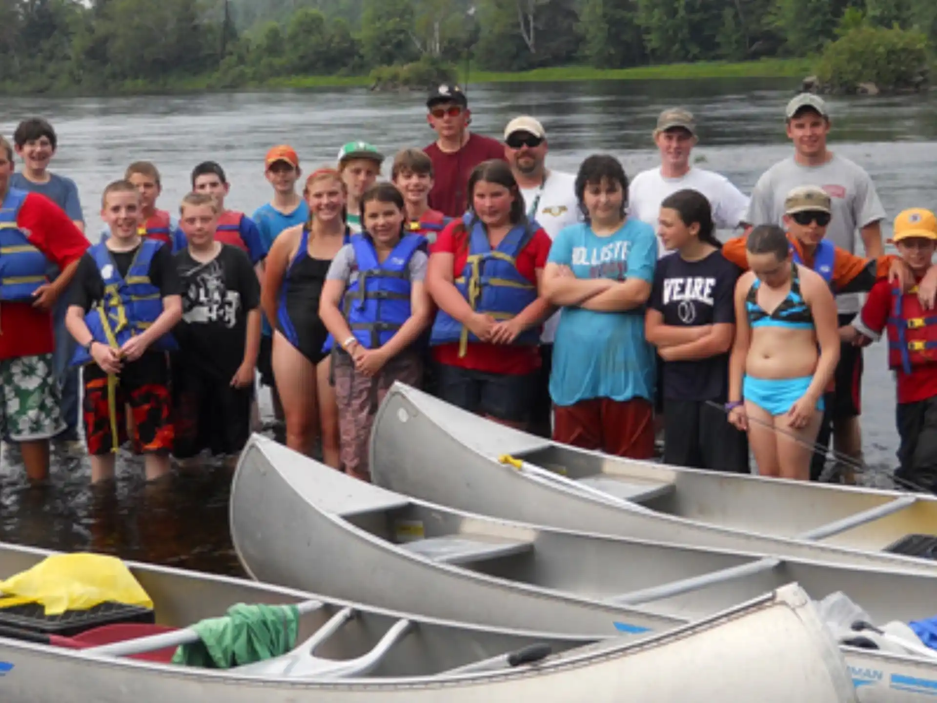 a group of people standing in a boat