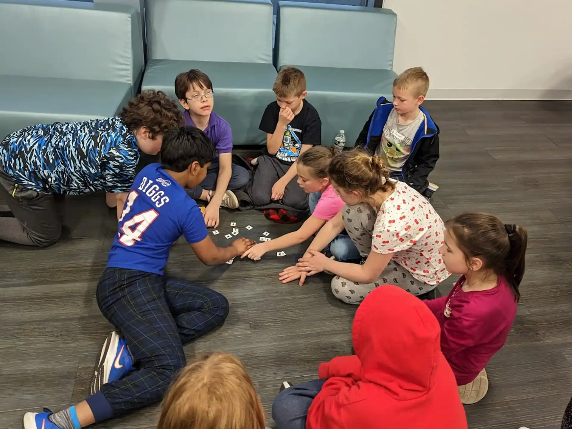a group of children sitting on the floor